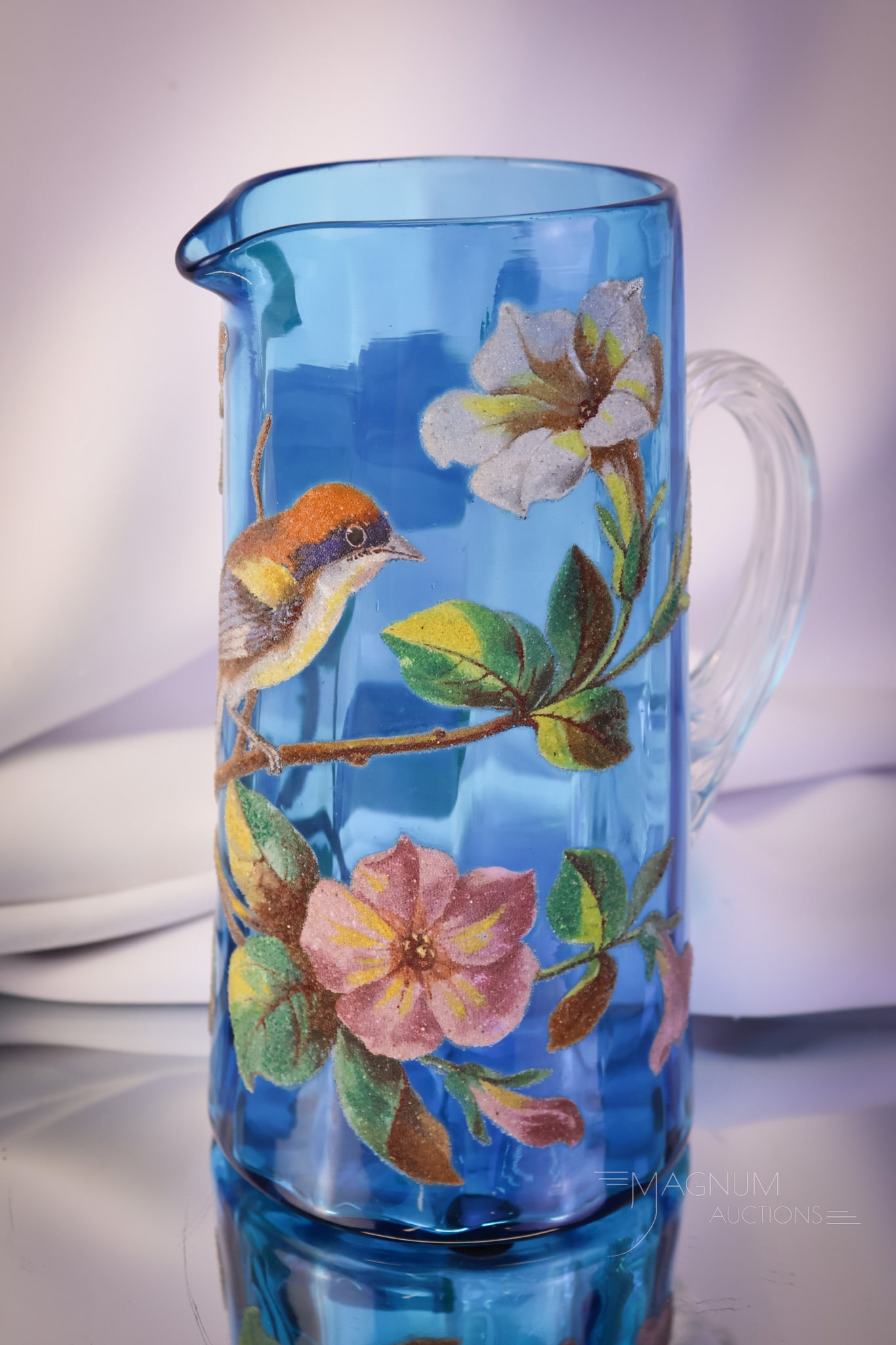 Victorian "Patent" Coralene Decorated Celestial Blue Water Pitcher: A super example of a Victorian art glass tankard water pitcher! This find has a brid on branch decoration in coralene. The pitcher measures 9" tall. It is signed, "Patent" on the base. SHIPPING NOTICE