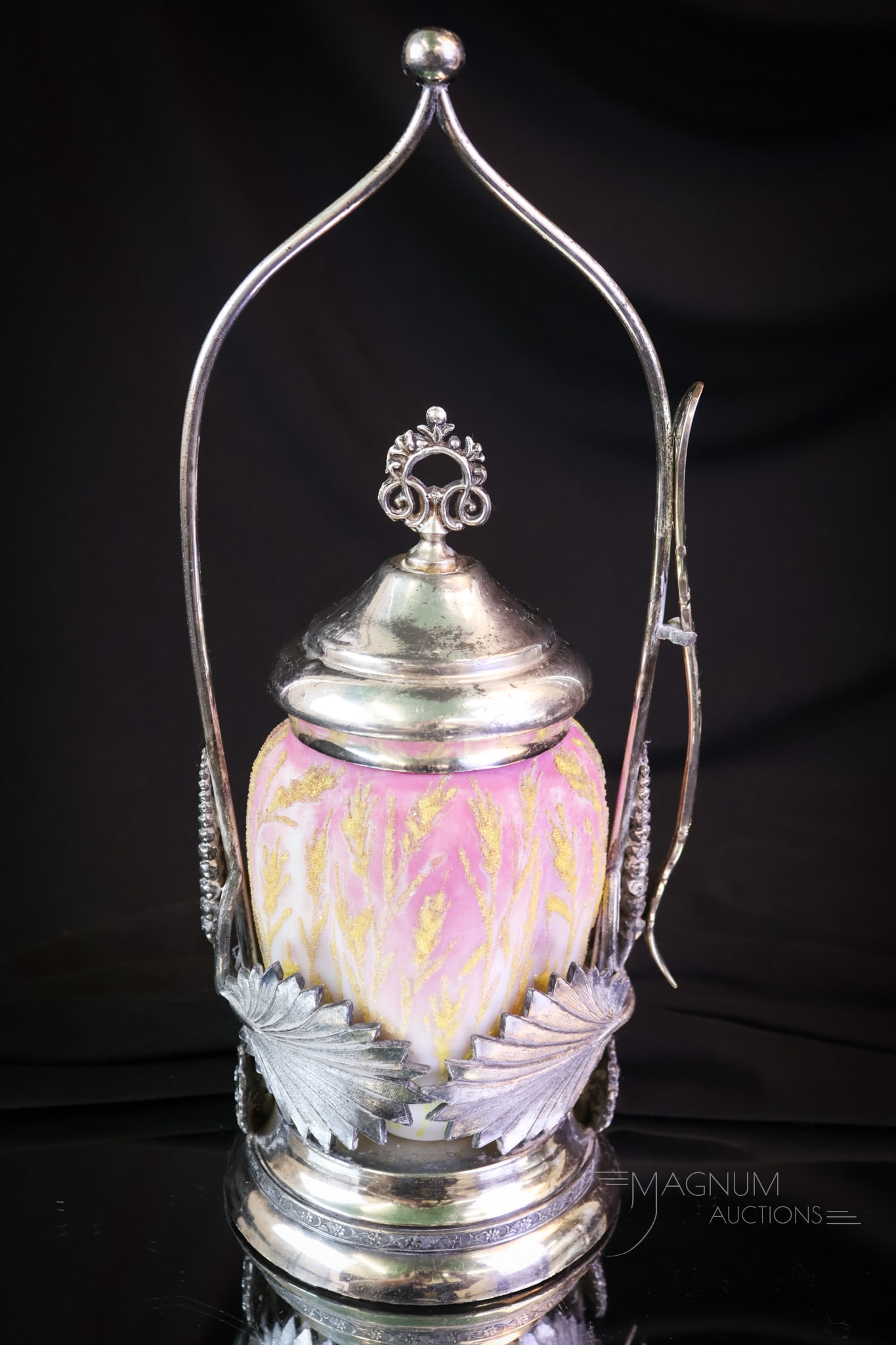Meriden Silverplate Victorian Coralene Pickle Castor: A beautiful Meriden Victorian silverplate pickle castor complete with a decorated opal glass and coralene insert. This fine castor features wheat on the frame as well as the wheat coralene decoration