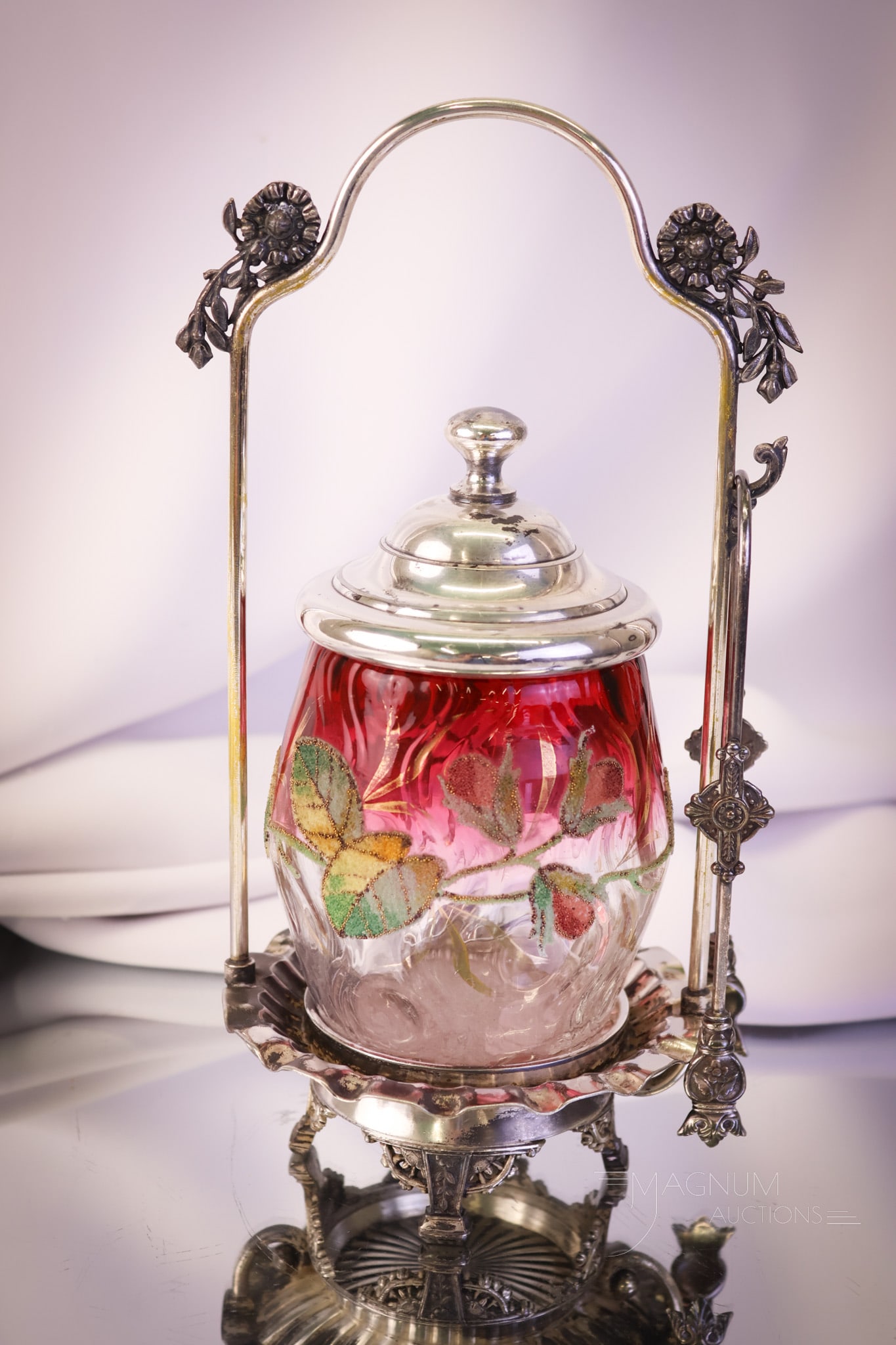 Meriden Victorian Silverplate Cranberry Rubina Coralene Pickle Castor: A lovely find to add to your collection. This is a signed Meriden silverplate Victorian pickle castor. The jar is cranberry rubina with a bark-optic pattern. The jar is decorated with enameled coralen