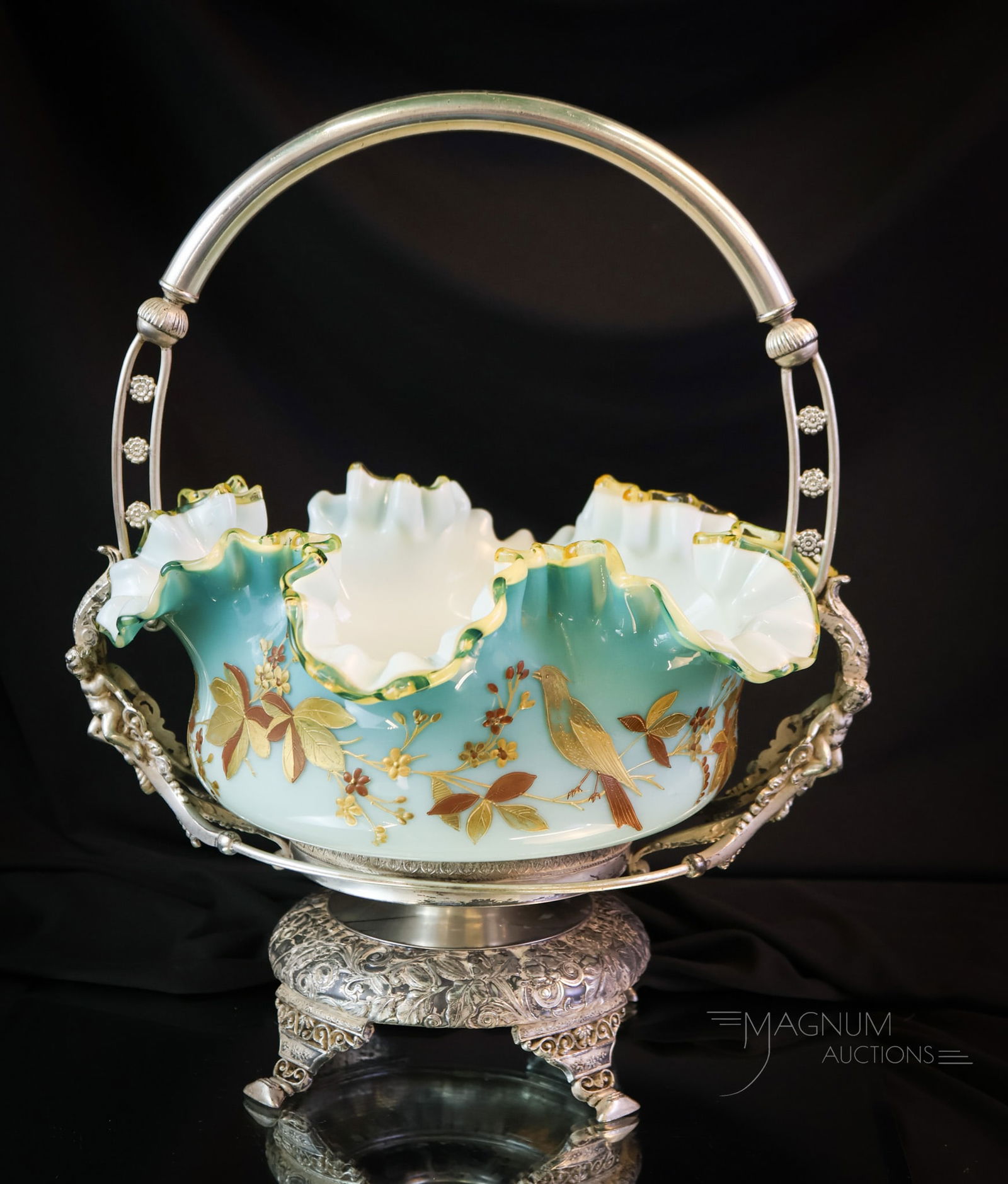 Wilcox Victorian Silverplate Uranium Cased Art Glass Brides Basket Bowl: A gorgeous Victorian signed Wilcox silverplate brides basket bowl centerpiece. This super example is rich in uranium content and shines brightly under black light. This piece is elaborately decorated