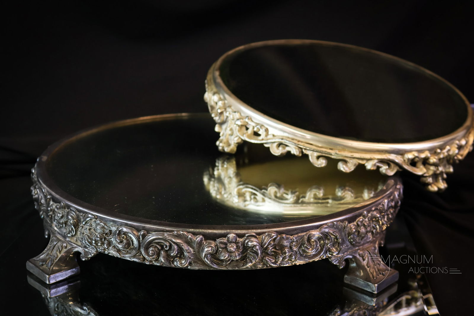 2 pc Lot Victorian Plateau Mirrors Reed & Barton & More: Two beautiful finds in Victorian silverplate plateau mirrors. The first is a signed Reed & Barton silverplate with a scrolling design and florals. The second is simply scrolling and appears to be unma