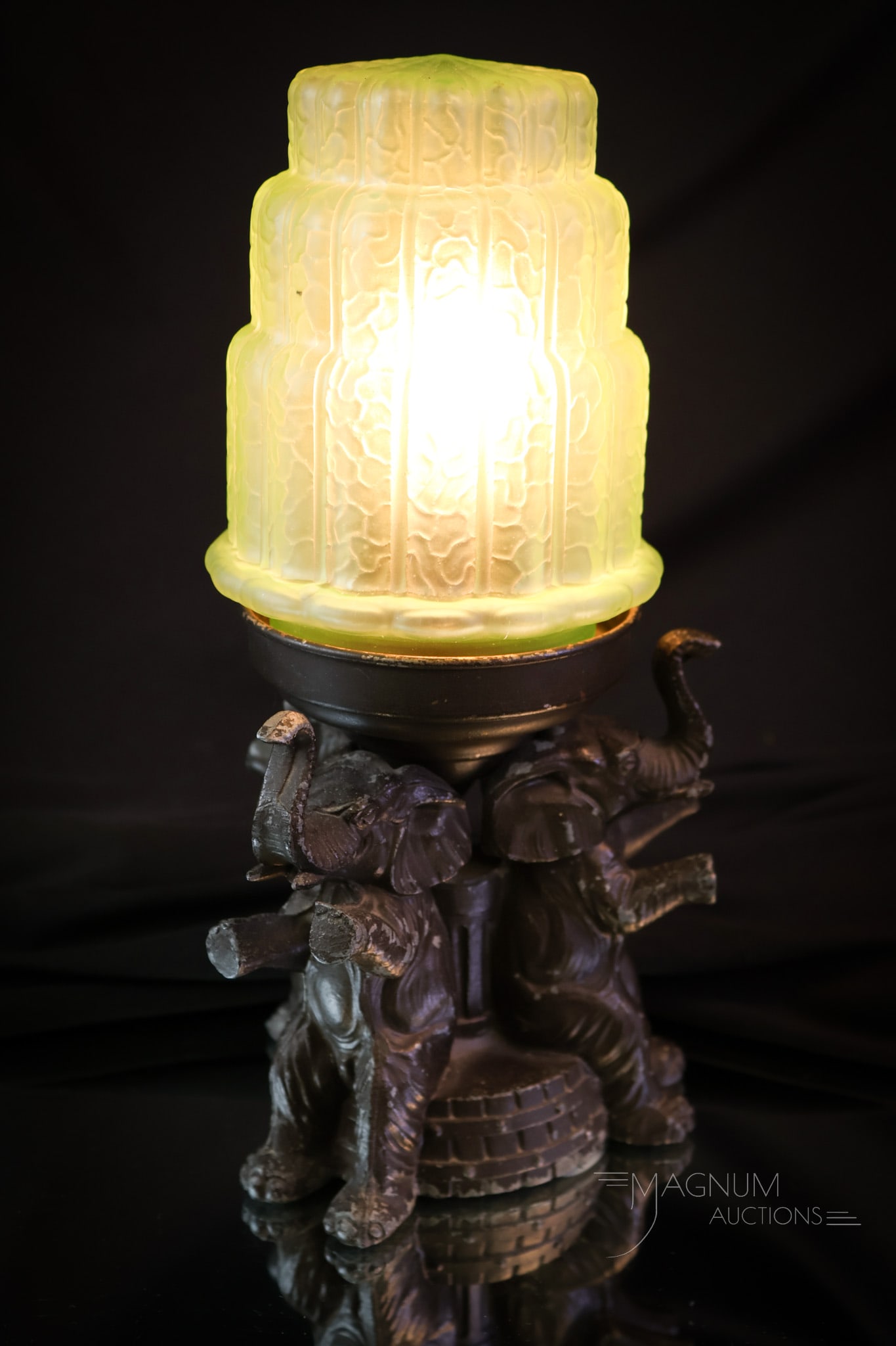 Art Deco Elephant Uranium Satin Glass Elephant Lamp: A charming find in an Art Deco period lamp. This lamp features elephants at the base and a satin uranium-rich green glass shade. The lamp measures 10" tall and 5" wide. SHIPPING NOTICE: If you choose