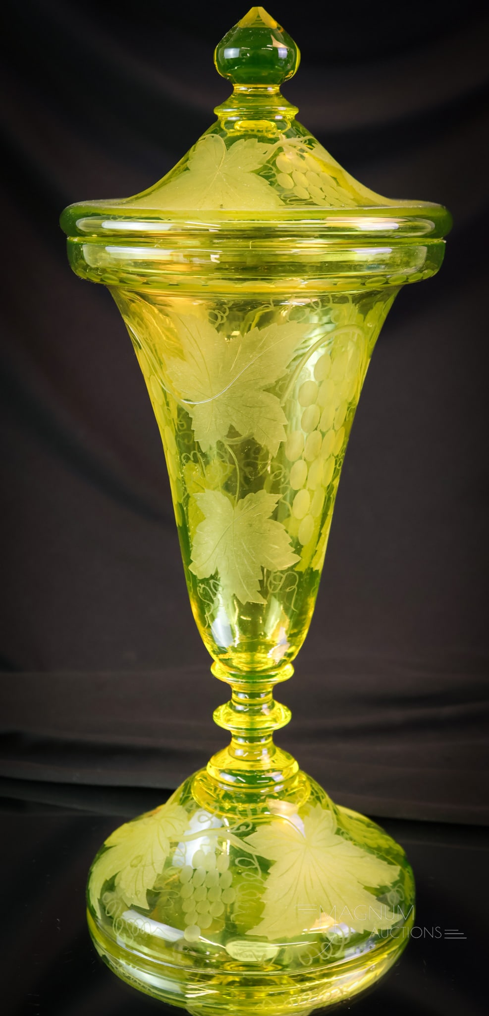 Pairpoint Vaseline Uranium Cut Glass Grapes Covered Urn: A beautiful find in Pairpoint cut/engraved glass. This covered urn glows brightly under black light with its rich uranium content. Its stately too measuring 14" tall of pure Vasie lovin' pleasure. SHI