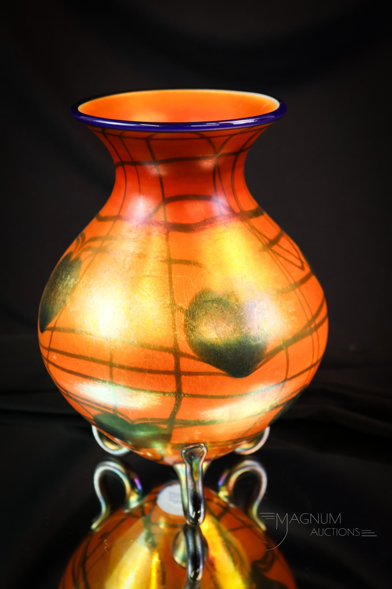 Imperial Freehand Orange Iridescent Heart & Vine Vase: A fabulous find in Imperial freehand art glass. This super example has an iridescent finish and heart and vine decoration. Three curled feet and a cobalt rim complete this piece. The vase measures 8"