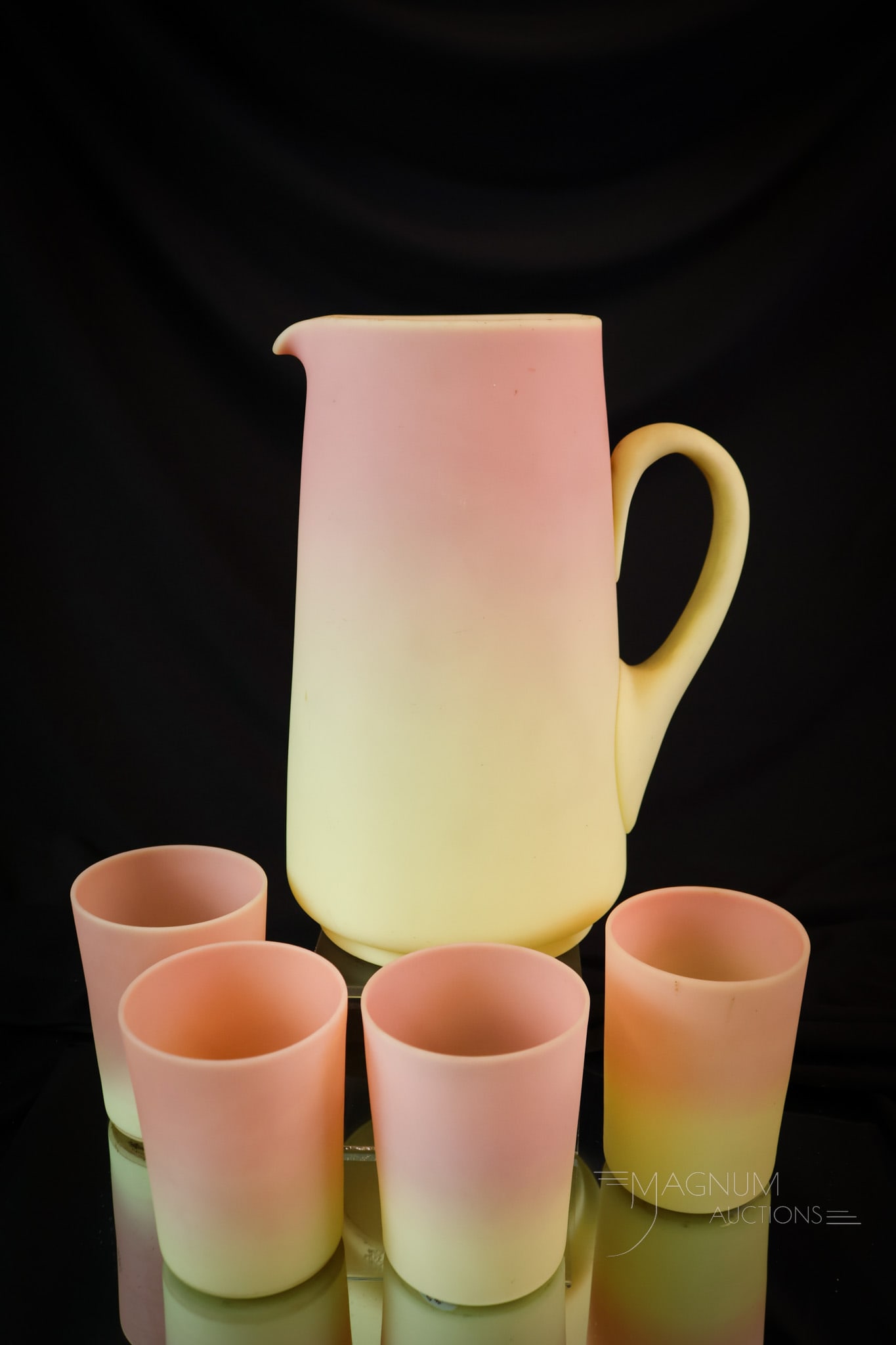 Mt. Washington Burmese Glass Victorian 5 pc Water Set: A beautiful Victorian Mt. Washington burmese glass water set. This set has a pitcher and four tumblers. All of the pieces have great coloring. A wonderful set. The tallest measures 9". SHIPPING NOTICE