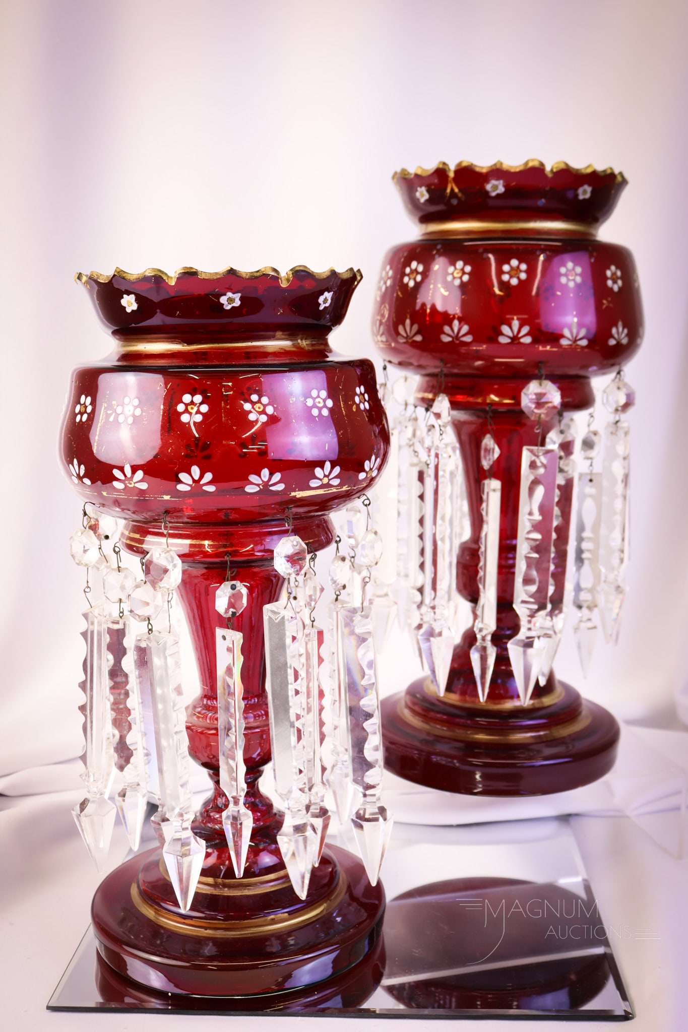 Pair Large 14 1/2" Ruby & Gold Victorian Art Glass Mantle Lustres: A gorgeous pair of ruby Victorian 14 1/2" tall gilt decorated mantle lustres. This pair is in deep, rich ruby glass. Each features a cut top rim and a gilt decoration with enameled flowers. Each lustr