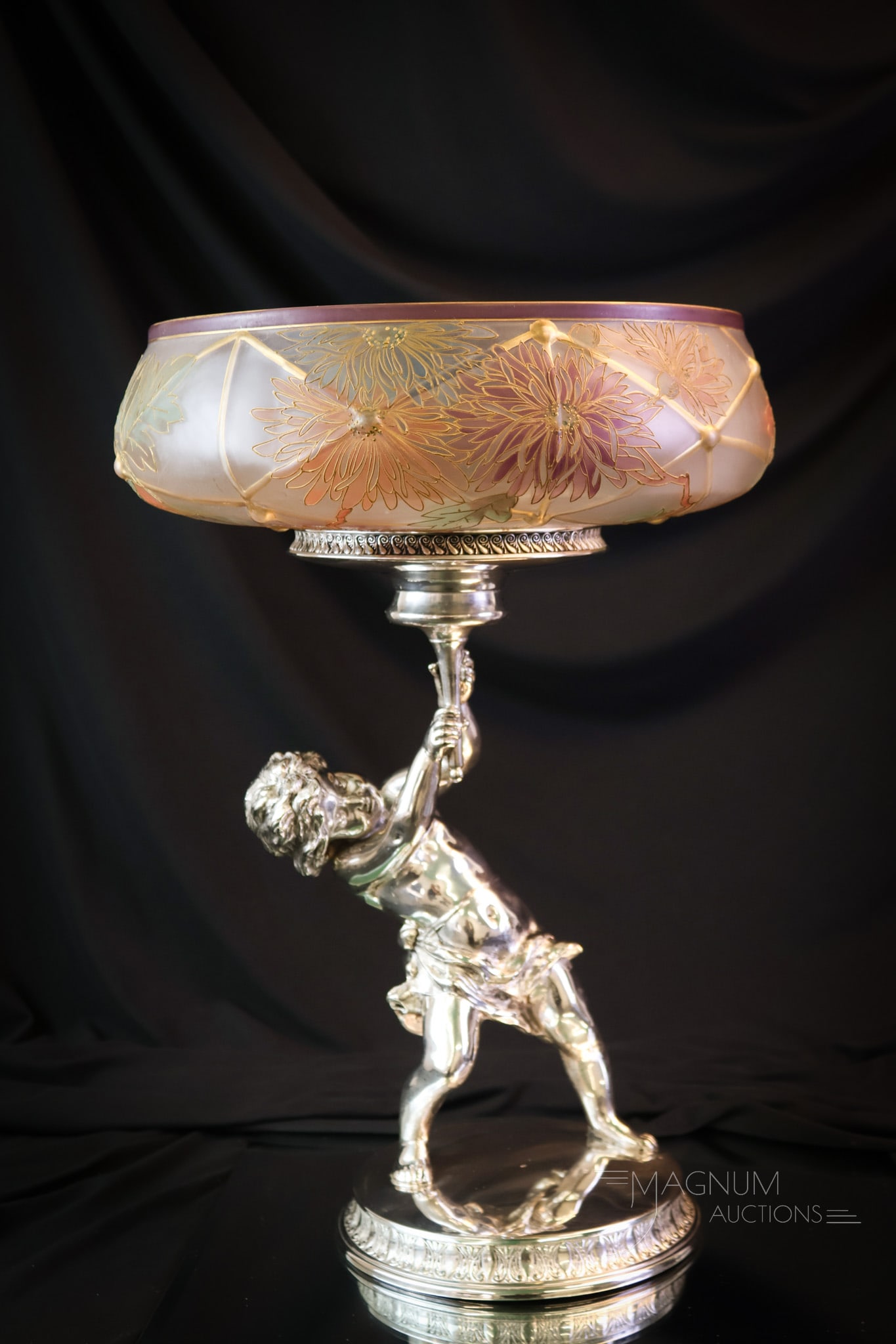 Mt. Washington Victorian Silverplate Royal Flemish Putti Brides Bowl Centerpiece: Another impressive find for your collection. This brides bowl centerpiece is spectacular! The silverplated putti base is signed Pairpoint. The bowl is Mt. Washington art glass in their Flemish line. I
