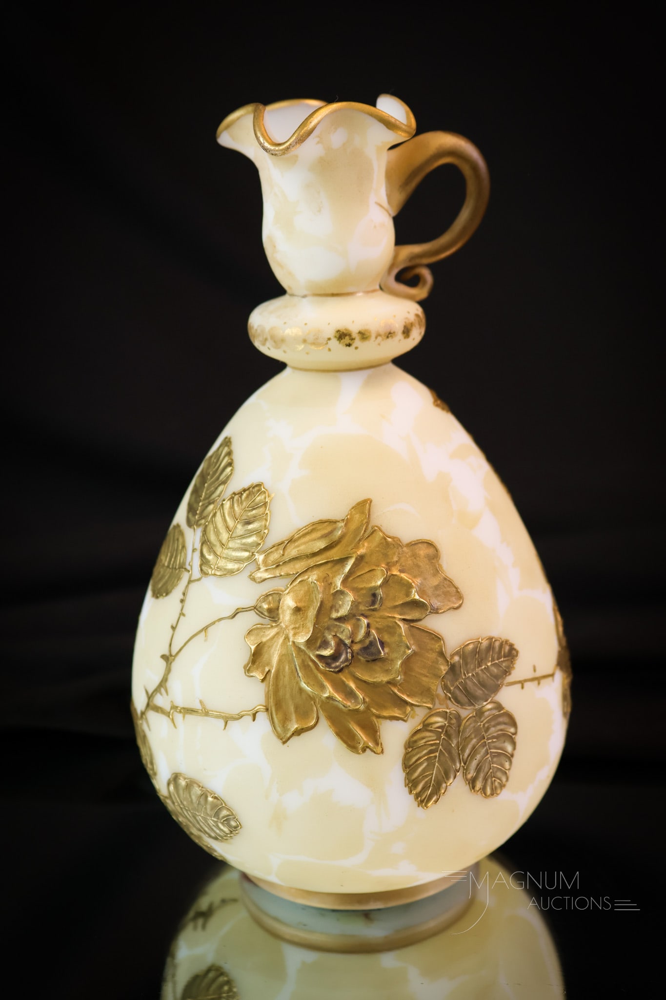 Victorian Crown Milano Art Glass Diminutive Gilt Ewer: A fun size to find a piece of Mt. Washington Crown Milano art glass in. This little gem measures only 6 1/2" tall. It has a heavy, built-up gold decoration of flowers and foliage. The piece retains a