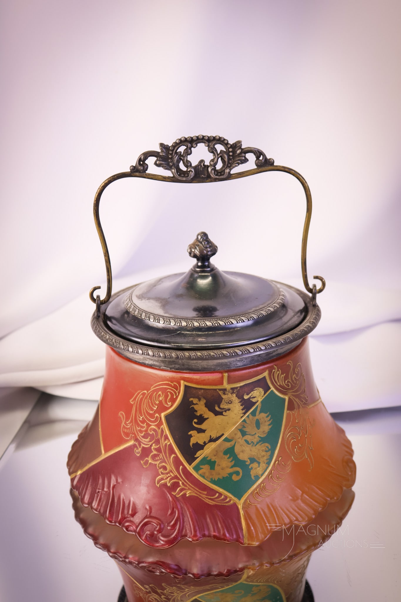 Signed Pairpoint Royal Flemish Victorian Art Glass Biscuit Jar: A wonderful find in Pairpoint/Mt. Washington Art Glass. This is a signed example in the Royal Flemish decoration. The biscuit jar has a lion on a shield included in the segmented decoration. The lid i
