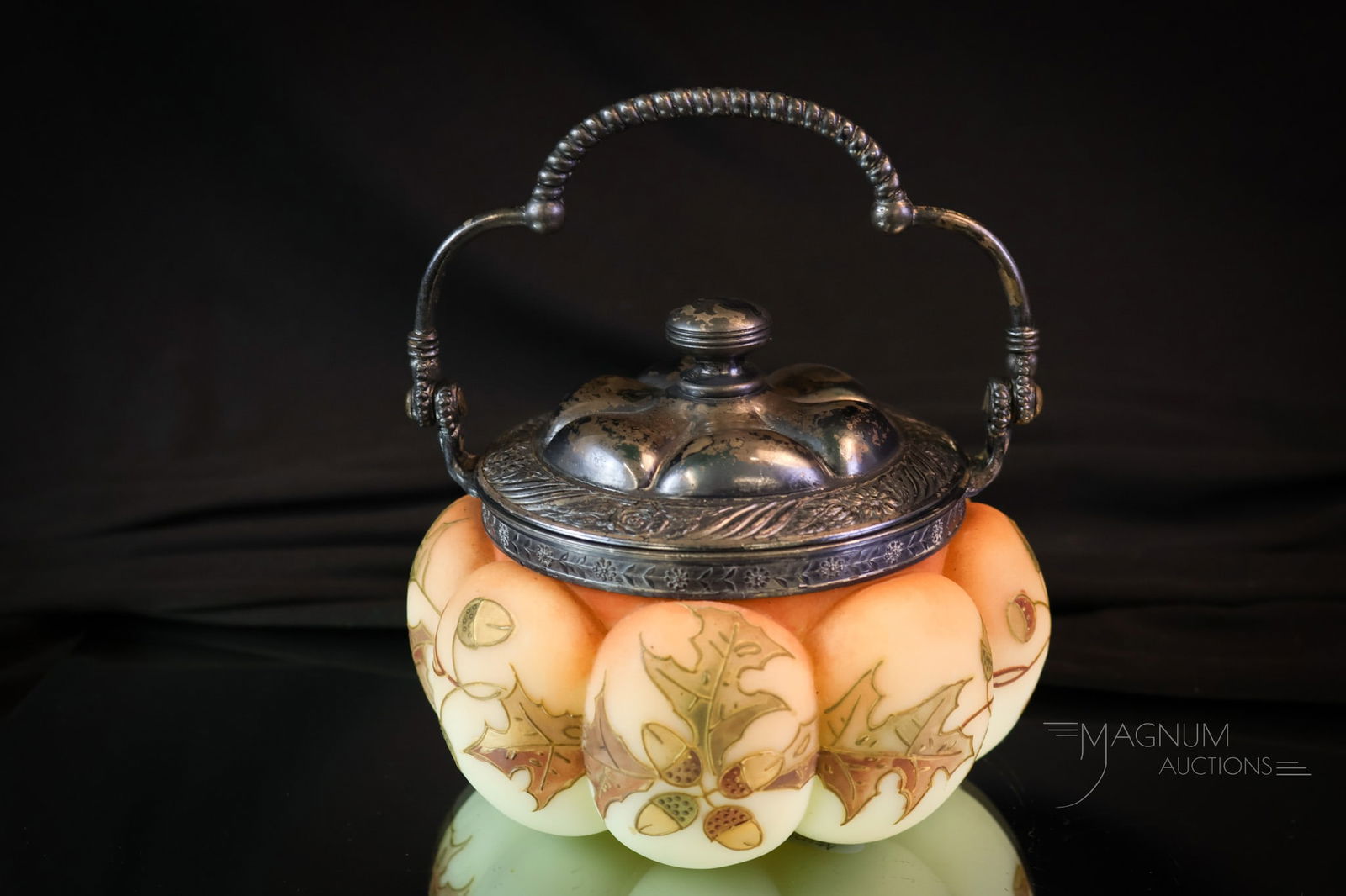 Mt. Washington Uranium Enameled Glass Sweetmeat: Another great find in our line-up of Mt. Washington art glass. This is a uranium-rich burmese lobed body sweetmeat. This Piece features oak leaf and acorn decoration. The lid is marked, "M.W." The pie