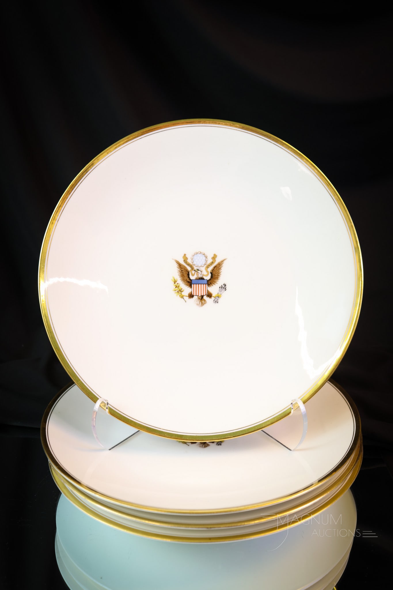 4 pc Lot T & V Limoges National Remembrance Group Washington DC Presidential Plates: A four-piece offering of T & V Limoges Presidential Plates. These are marked, "The National Remembrance Group, Washington D.C. Each plate has an eagle motif in the center. They each measure 9 1/2" in