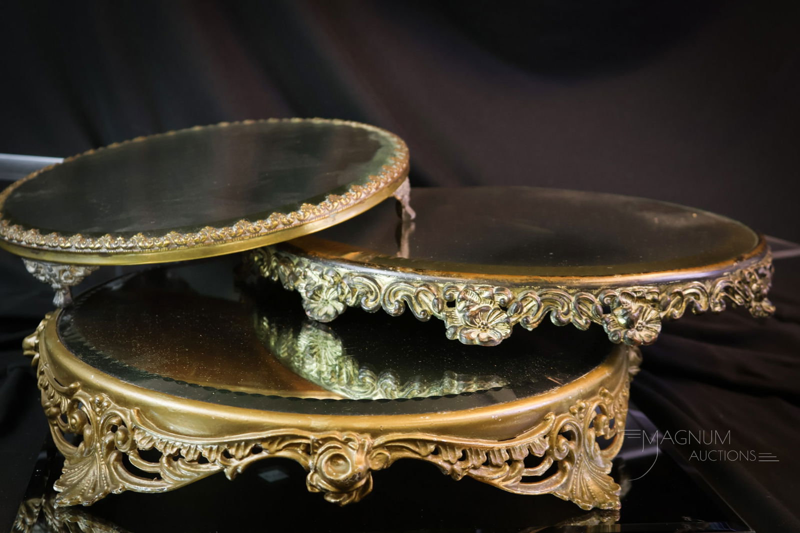 3 pc Lot Victorian Silverplate Floral Embossed Beveled Plateau Mirrors: Three excellent examples of Victorian silverplate, floral embossed, plateau mirrors. Each is in a unique size. Sizes vary from 10-12" in diameter. Provenance: This item is from the private collection