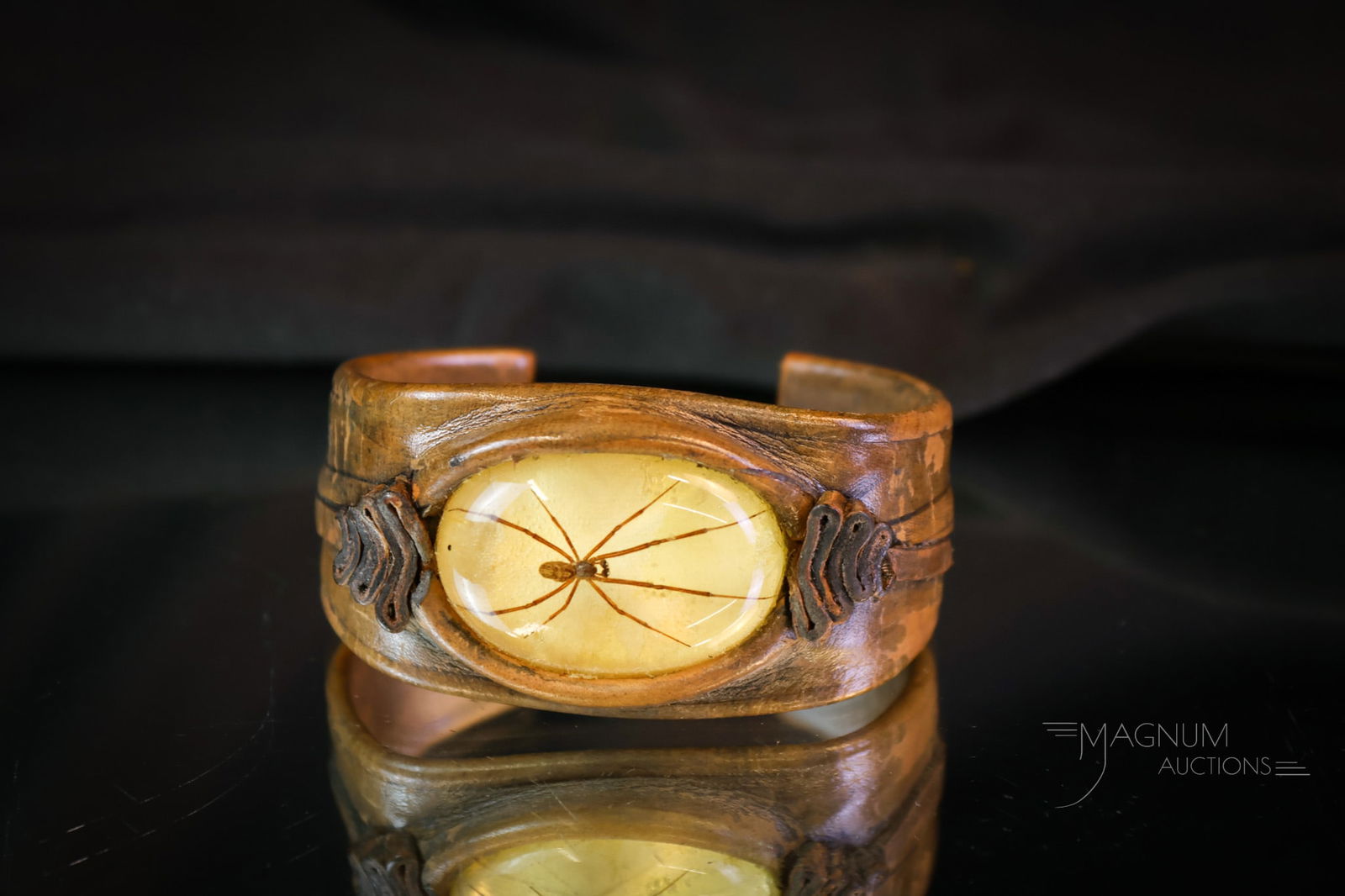 Rare Leather & Spider Cuff Bracelet: An interesting and rare cuff bracelet featuring a leather band and an oval resin cabochon with a real spider encased in it. The bracelet measures 2" tall and 2 3/4" wide. SHIPPING NOTICE: If you