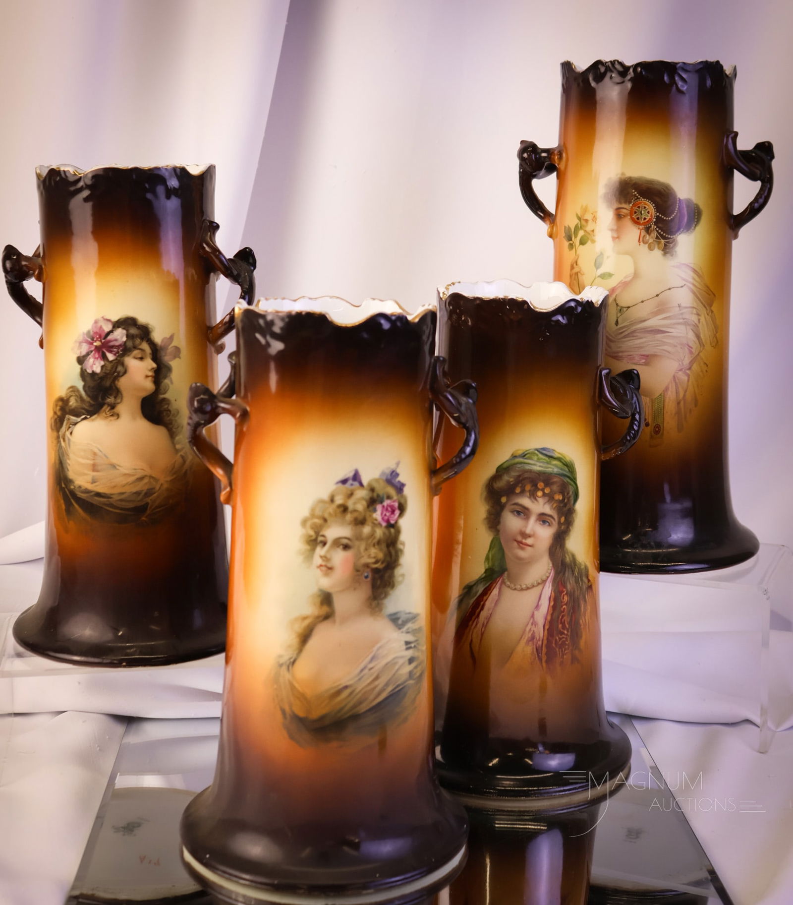 4 pc Lot Warwick China Porcelain Portrait Vases: Four unique finds in Warwick china porcelain portrait vases. Each has twisted handles. These vases feature ladies of ill repute. The tallest measures 12". Provenance: This item is from the private co