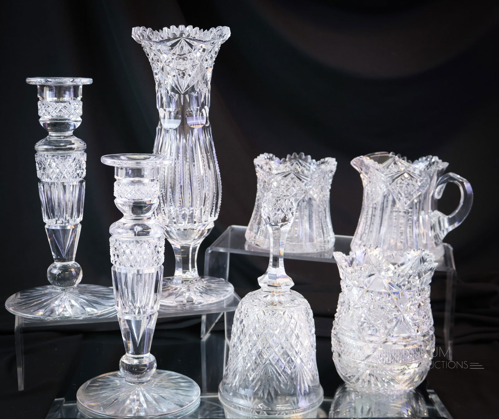7 pc Lot ABP American Brilliant Period Cut Glass Hawkes & More: A generous offering of seven pieces of American Brilliant Period cut glass. This lot includes a Hawkes "Brunswick" pattern creamer and sugar. A Hobstar diamond band spooner. A pair of candlesticks in