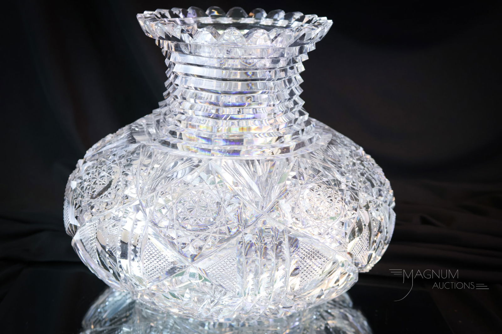 American Brilliant Period Cut Glass Flower Center Vase: A wonderful diminutive American Brilliant Period cut glass flower center vase. This fine example with a Hobstar and fan cutting. This one measures 8" tall and 9 1/2" wide. SHIPPING NOTICE: If you choo