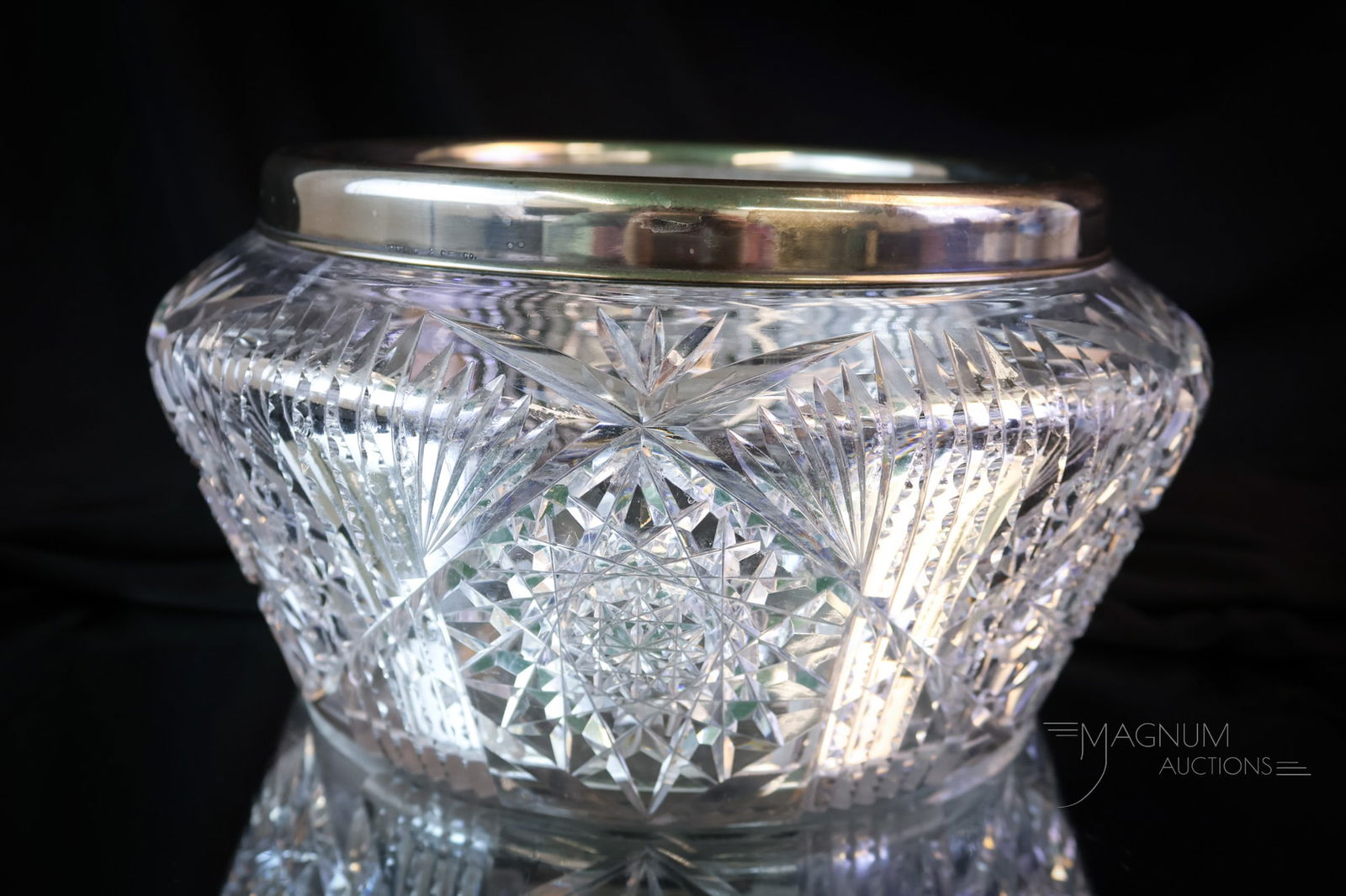 C.F. Monroe Wavecrest & Sterling Cut Glass Ferner: A nice find in C.F. Monroe Wavecrest cut glass. This ferner measures 10" in diameter and 5" tall. The ferner is completed by a sterling silver rim. The ferner exhibits scratching on the bottom and a f