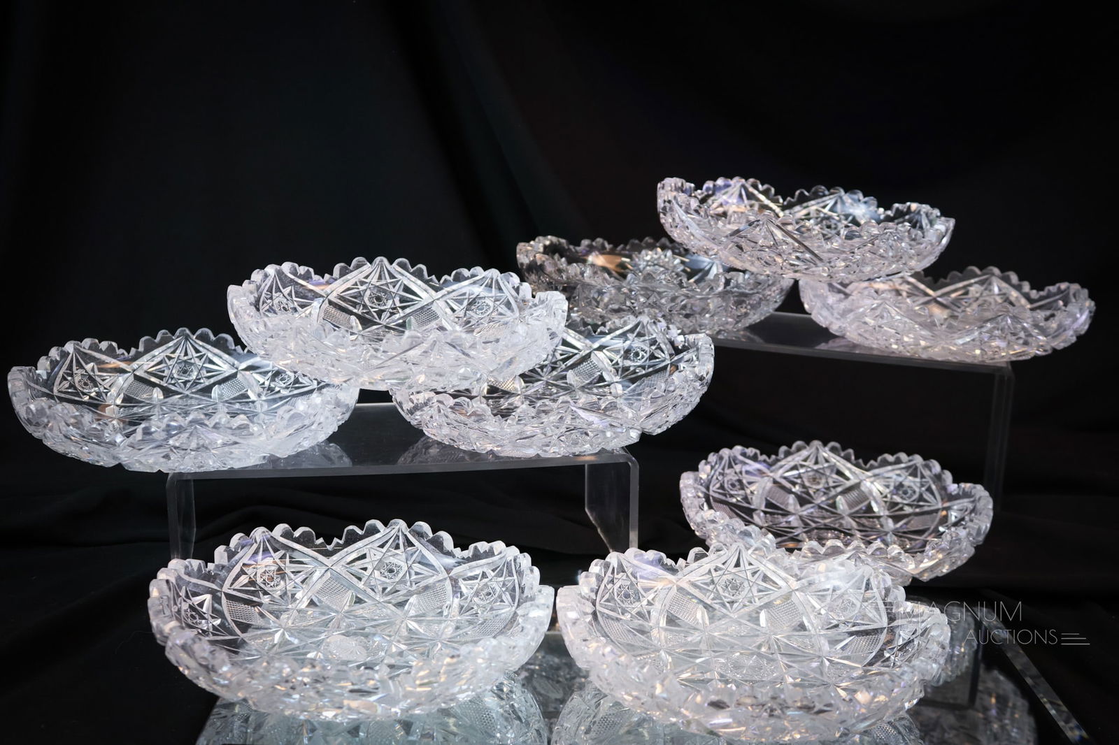 10 pc Lot Signed Hawkes Cut Glass Ice Cream Bowls: A set of ten signed Hawkes cut glass ice cream bowls. Each of these are delicately cut and each measures 1 1/4" tall and 6 1/4" wide. SHIPPING NOTICE: If you choose not to utilize the LiveAuctioneers