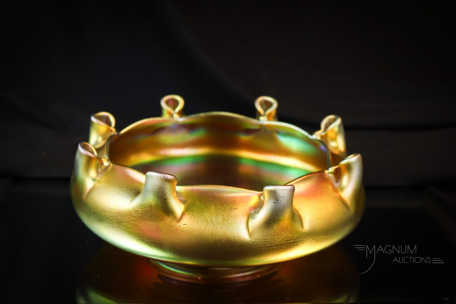 Steuben Gold Aurene #2775 Art Glass Bowl: A fine find in Steuben gold Aurane art glass. This bowl is signed "Aurene 2775". The bowl features a rim with eight pinched bud holders. The bowl measures 3" tall and 8" wide. SHIPPING NOTICE: If you