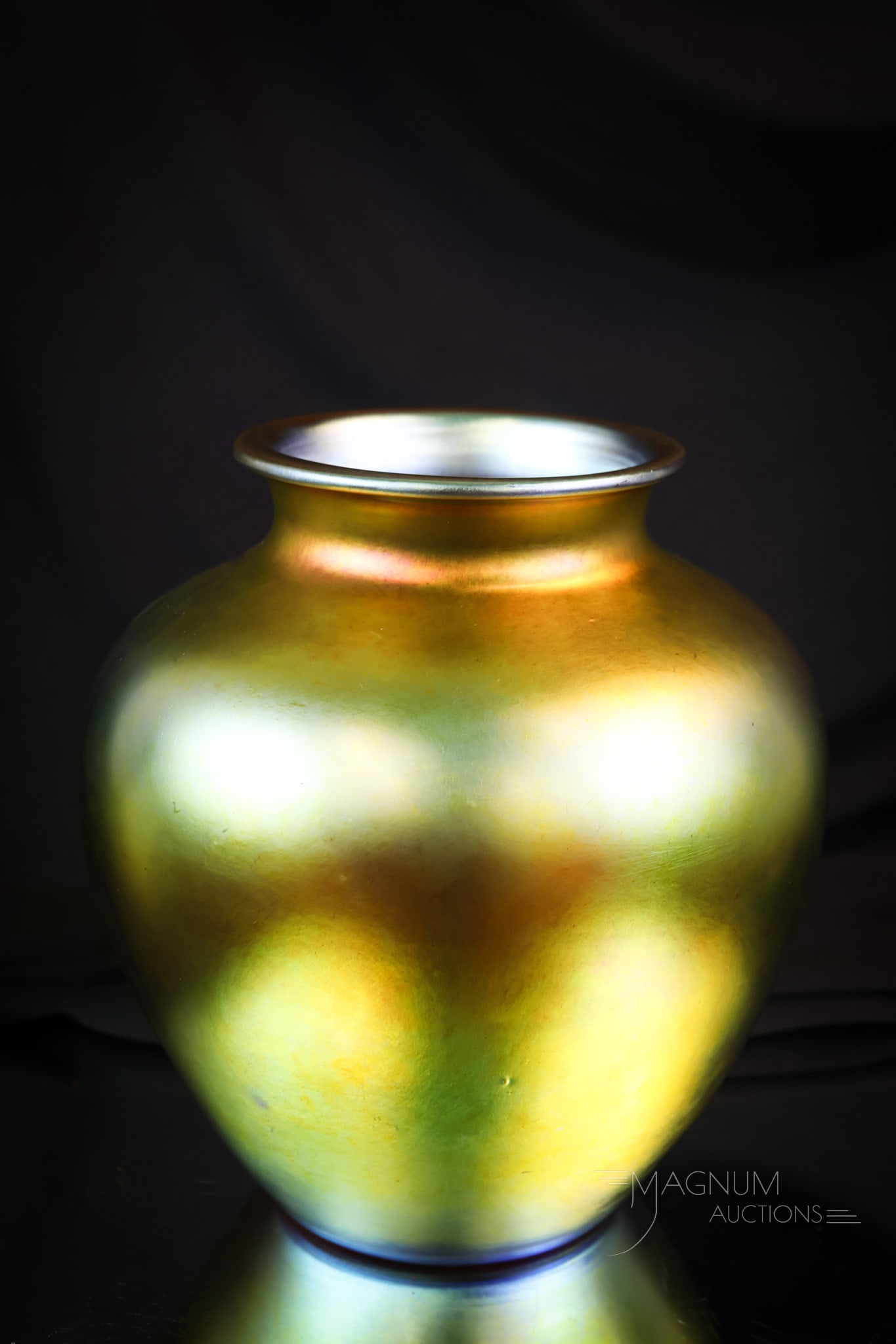Steuben Gold Aurene Art Glass 8 1/4" Vase: A fine example of a classic-form Steuben art glass gold Aurene glass vase. This vase is marked "Steuben Aurene" and an illegible shape number. The vase measures 8 1/4" tall and 7 1/2" wide. SHIPPING N