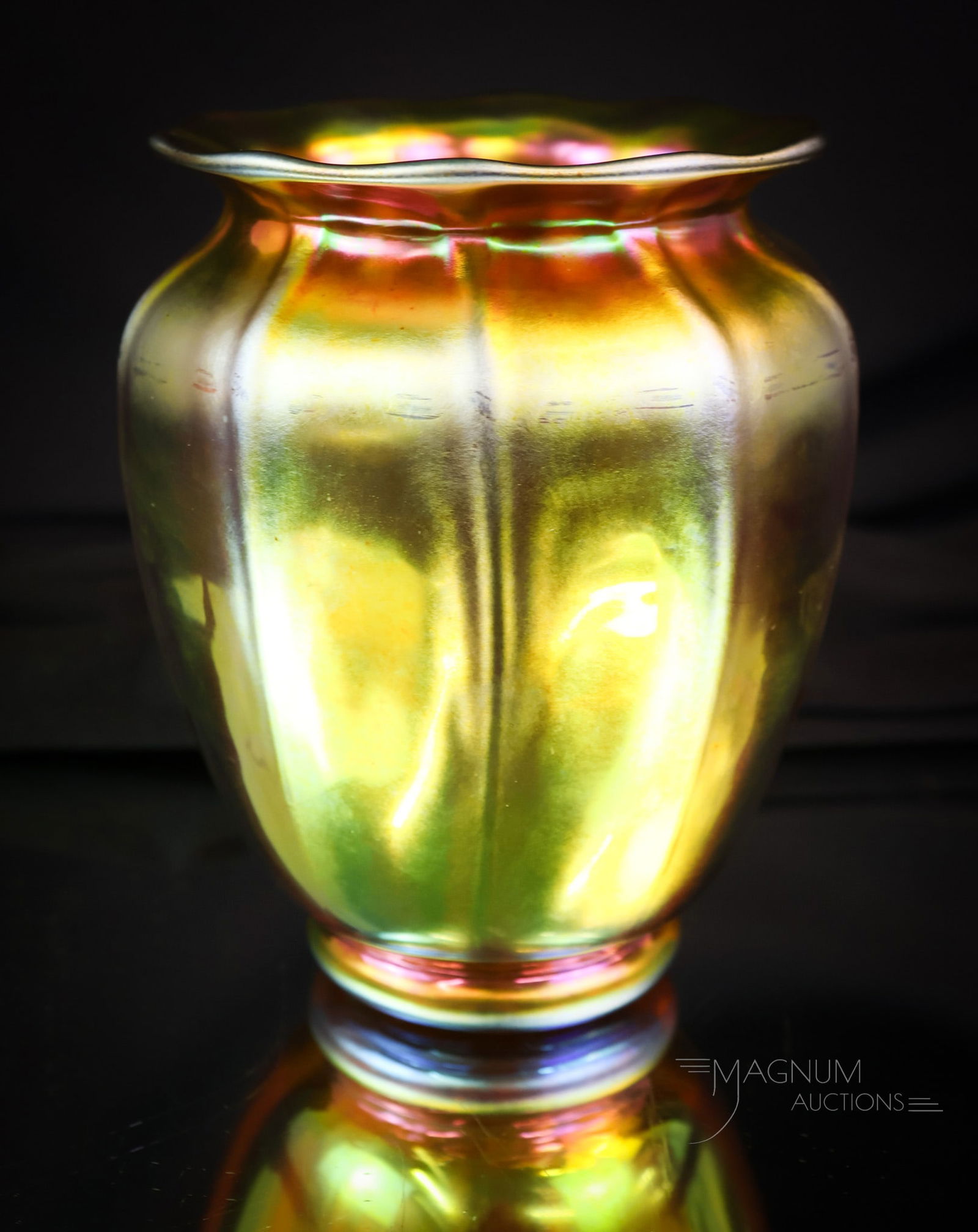 Steuben Gold AurneRibbed Art Glass Vase: A fine example of Steuben gold Aurne art glass. This little vase measures 5" tall. It has external ribbing and a flared design. The vase is marked "Steuben." SHIPPING NOTICE: If you choose not to util