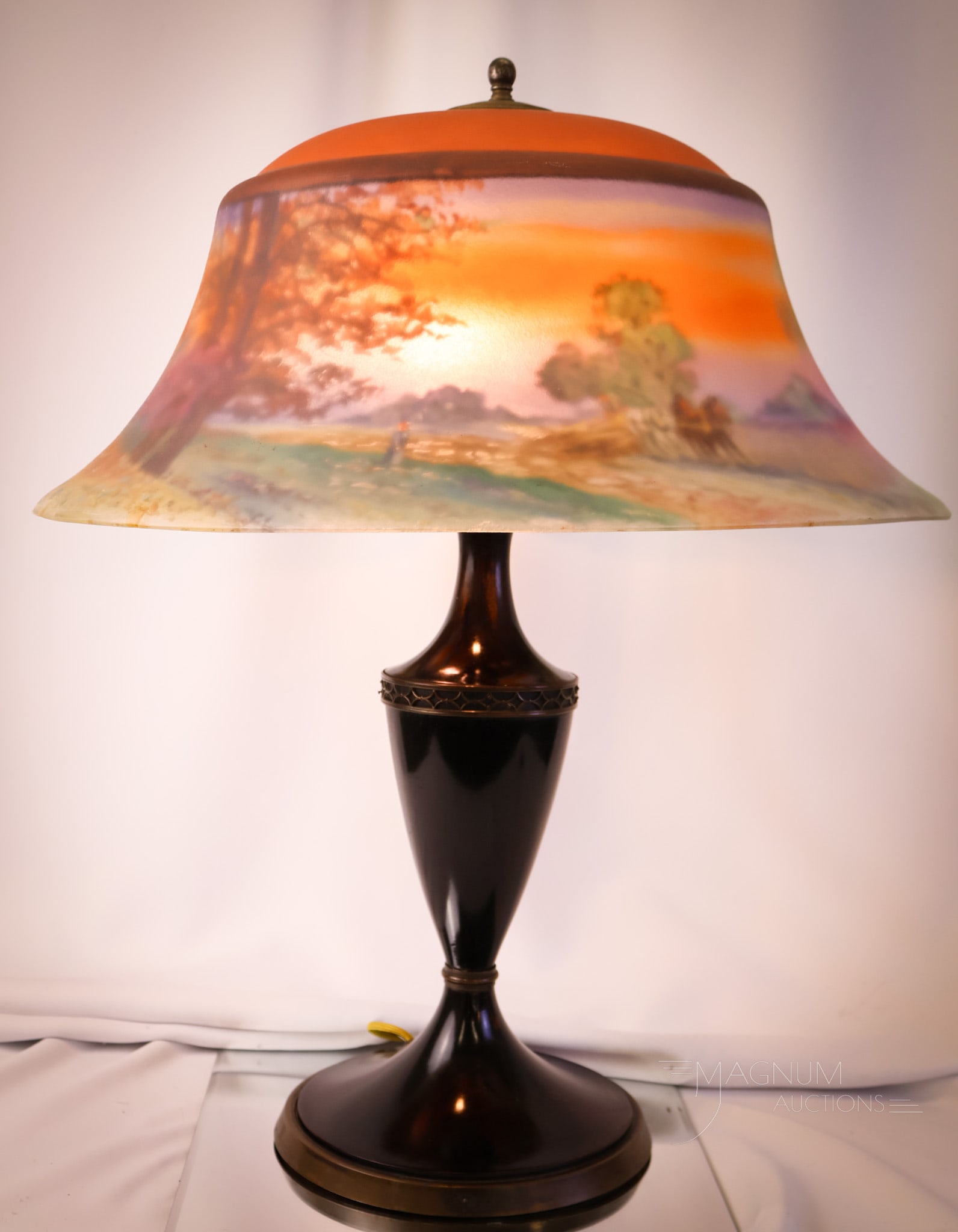 Pairpoint Exeter Reverse Painted Harvest Scene Table Lamp: A Pairpoint reverse-painted harvest scene table lamp. This lamp features a Pairpoint Exeter pattern shade with a fall harvest farm scene decoration. The shade is signed "Macy" and also "Pairpoint." Th