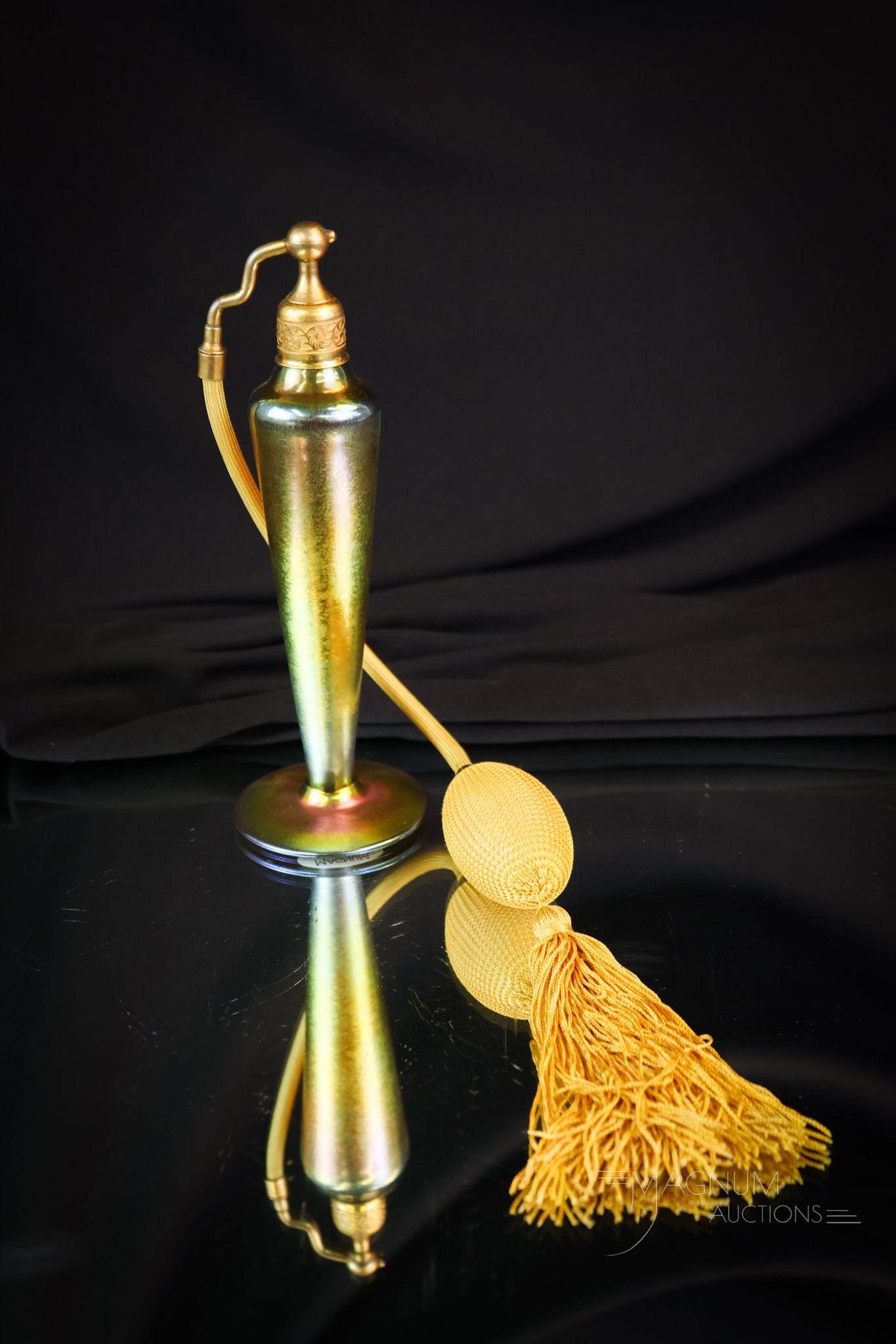 Steuben Gold Aurene Art Glass Perfume Atomizer: A wonderful gold Staeben Aurene perfume atomizer. This great example has brilliant gold coloring. The atomizer measures 7" tall and 2 1/2" wide. SHIPPING NOTICE: If you choose not to utilize the