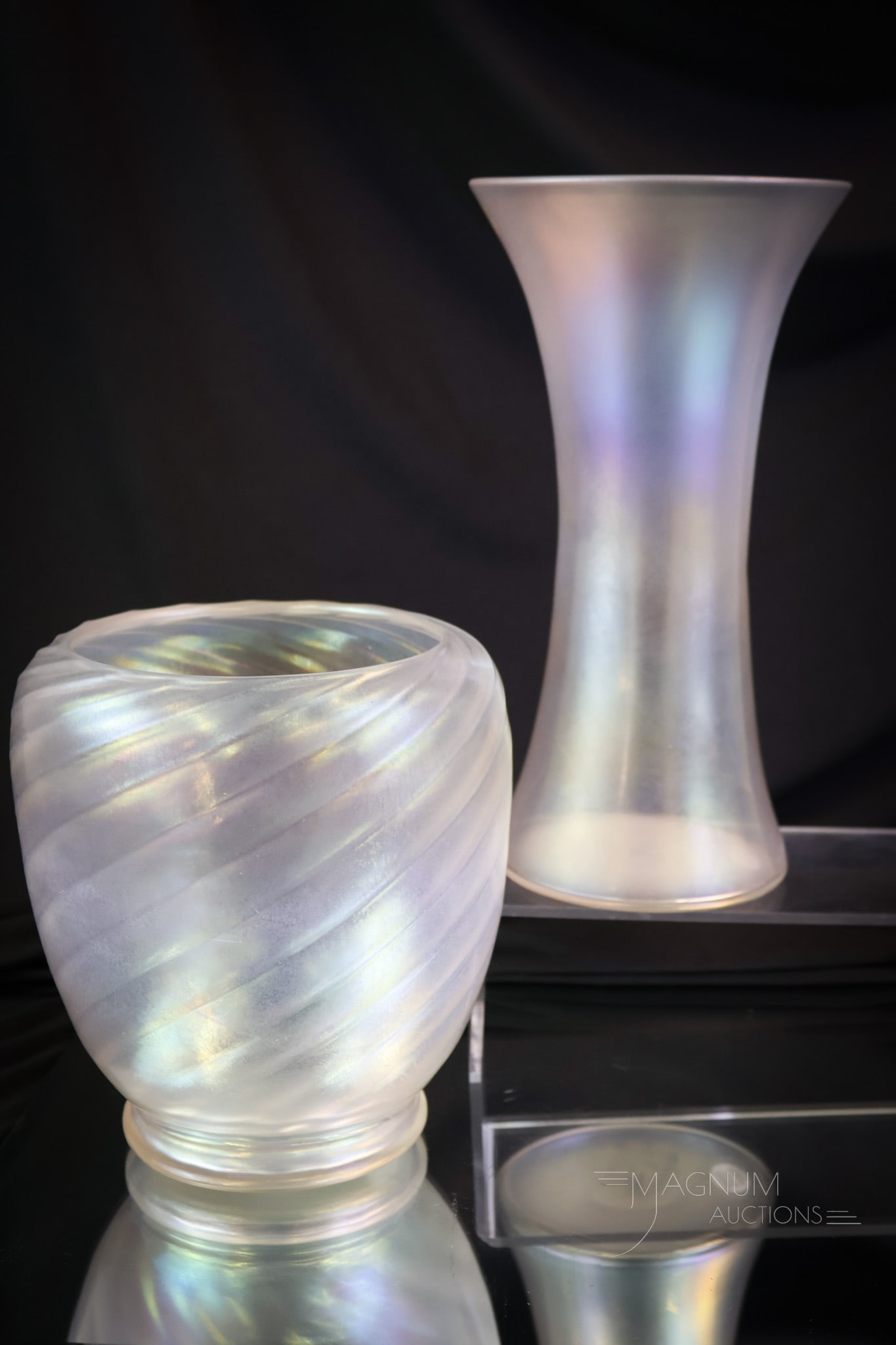 2 pc Lot Steuben Verre De Soie Art Glass: Two delights in Steuben Verre De Soie art glass. The first is a swirl mold vase. The second is a flared, tall vase. The tallest measures 9 3/4". SHIPPING NOTICE: If you choose not to utilize the LiveA