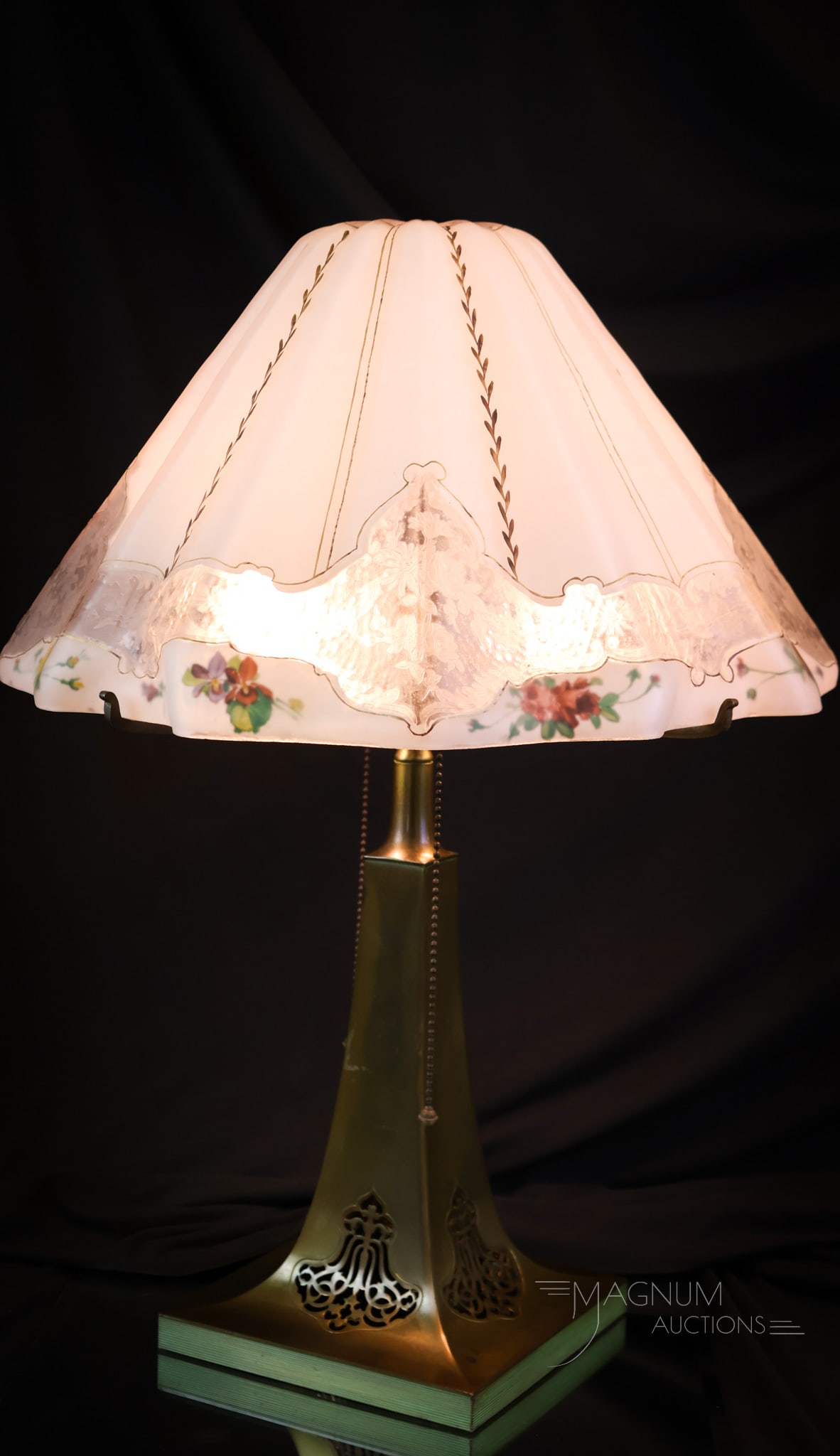 Pairpoint Magenta Reverse Painted Table Lamp: A beautiful signed, both on the shade and the base, Pairpoint reverse-painted table lamp. This lamp features a Magenta pattern shaped shade. The shade is etched on the exterior with a floral pattern a