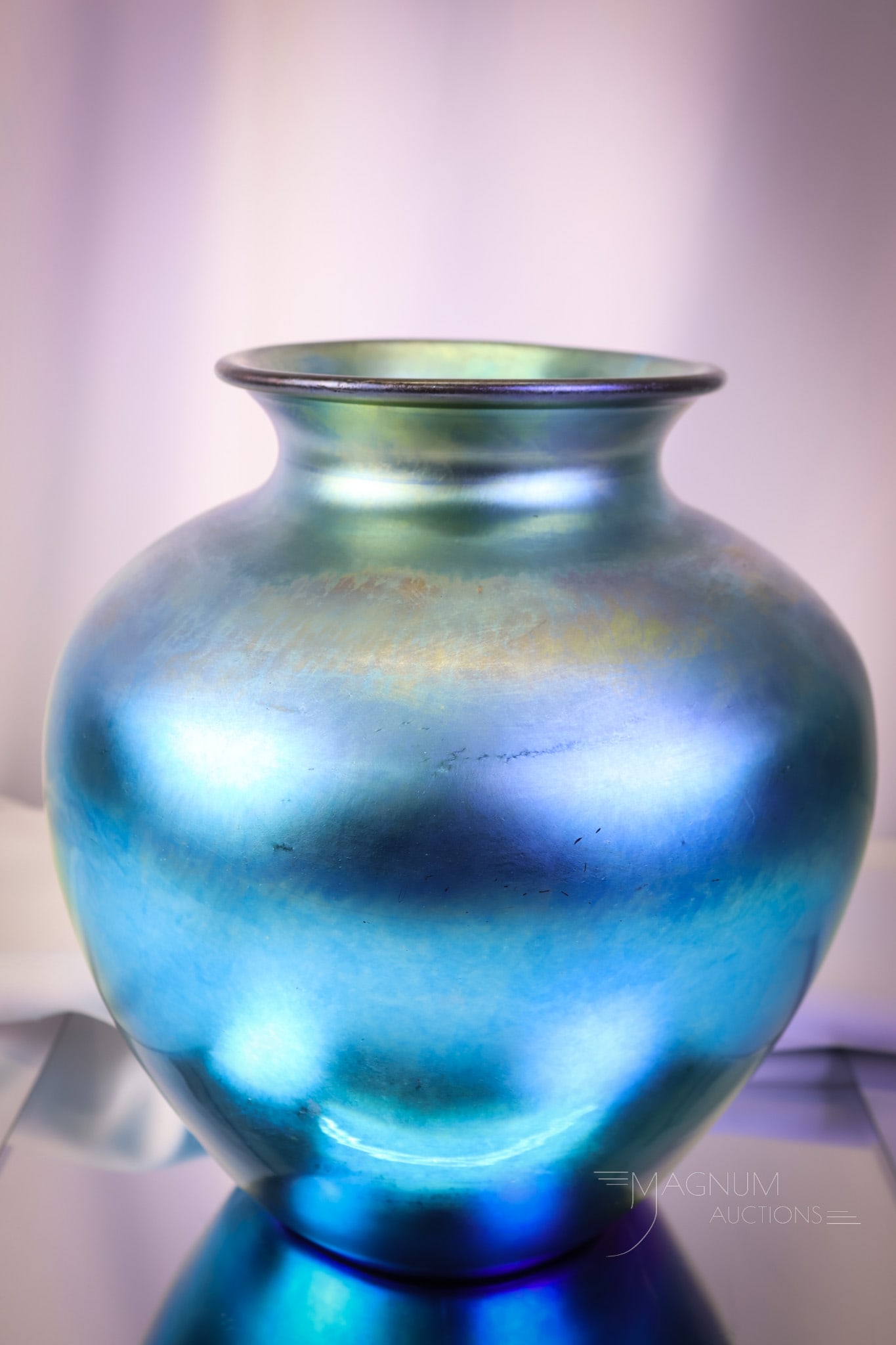 Steben Blue Aurene Classic Form Art Glass Vase: A beautiful classic form Steuben art glass vase. This fine example is marked "Steuben Aurene." The vase measures 10 1/2" tall. SHIPPING NOTICE: If you choose not to utilize the LiveAuctioneers