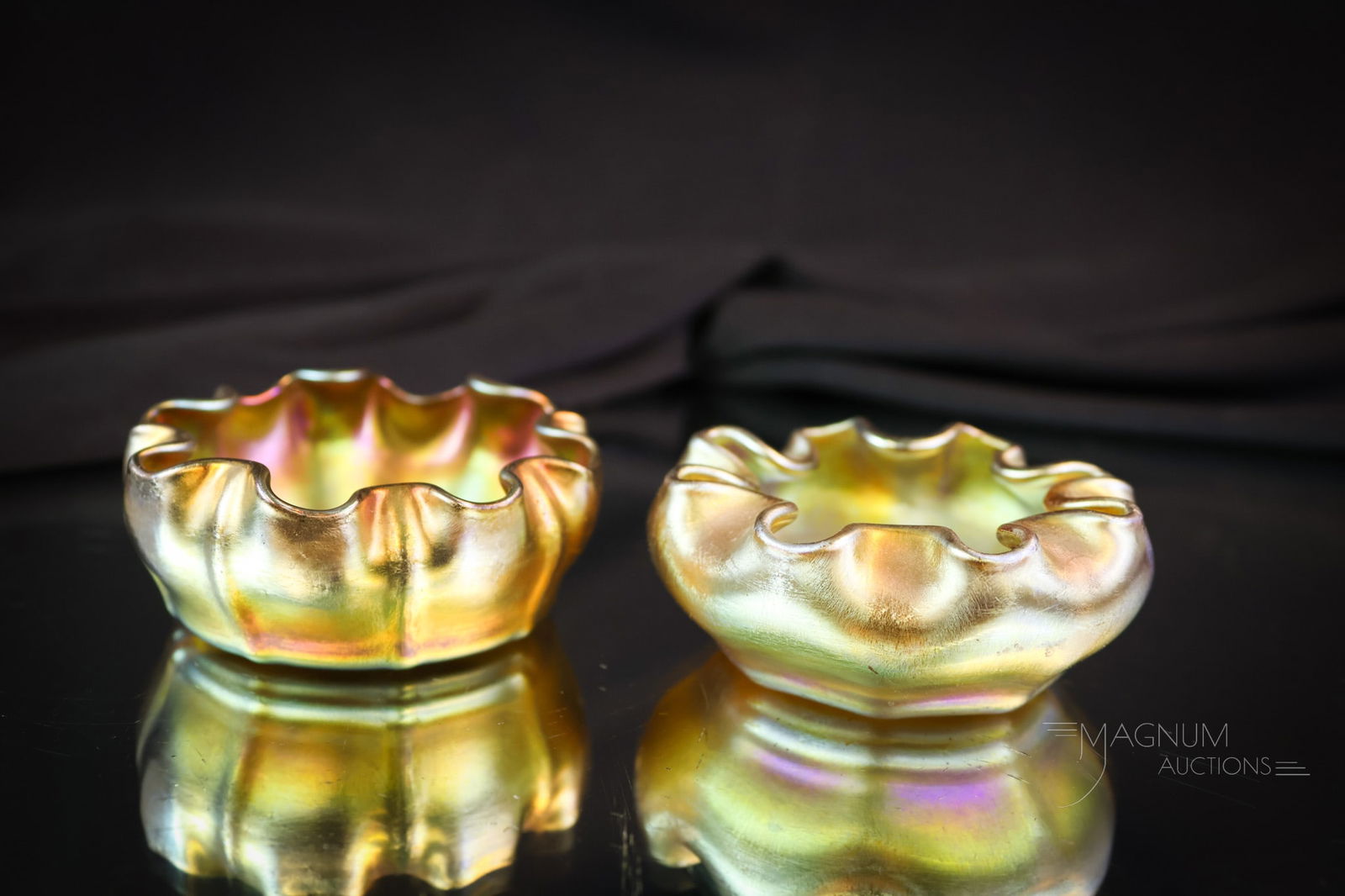 Pair Tiffany Gold Favrile Art Glass Open Salts: Two nice Tiffany Favrile art glass open salts for your bidding pleasure. These are nice with good coloring and form. They are each marked "L.C.T." Each measures 1" tall and 2 1/2" wide. SHIPPING