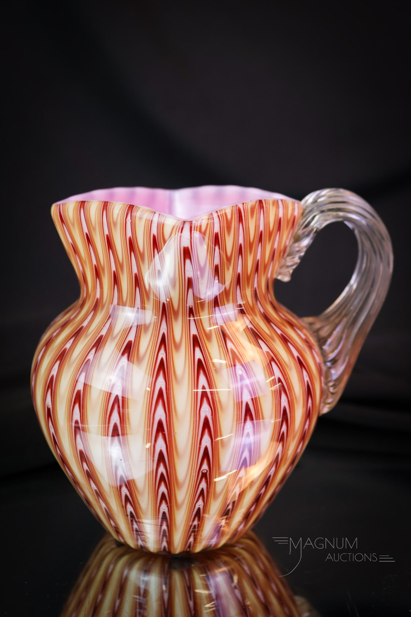 Stevens & Williams Northwood Pull-Up Osiris Cream Pitcher: A charming find in a Stevens & Williams Northwood Pull-Up or Osiris pattern art glass cream pitcher. This little gem measures 4 1/2" tall. It has rich coloring and pulled up effect. This super example
