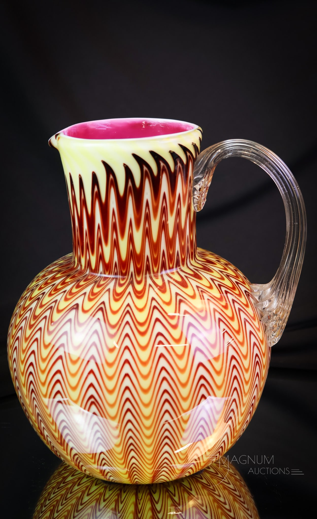Stevens & Williams Northwood Pull-Up Osiris Victorian Art Glass Water Pitcher: A rare find in Victorian art glass. This is a Stevens & Williams Northwood Pull-Up Osiris pattern water pitcher. This gorgeous and rare example has a vivid pink cased glass interior and great external