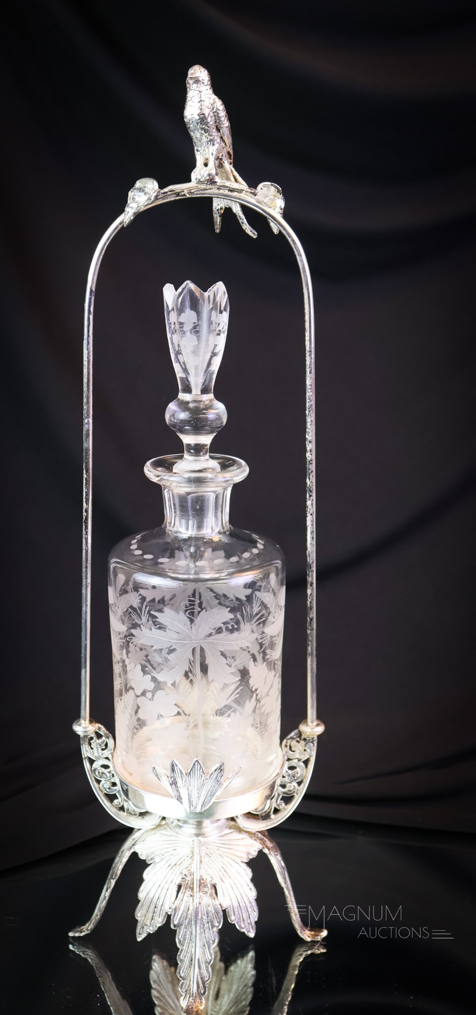 Victorian Silverplate Figural Bird Glass Perfume Castor: A beautiful find for any collection. This is a figural bird perfume bottle castor. This silverplate ornate frame, complete with leaf-form legs, holds the original etched glass perfume bottle. This Vic