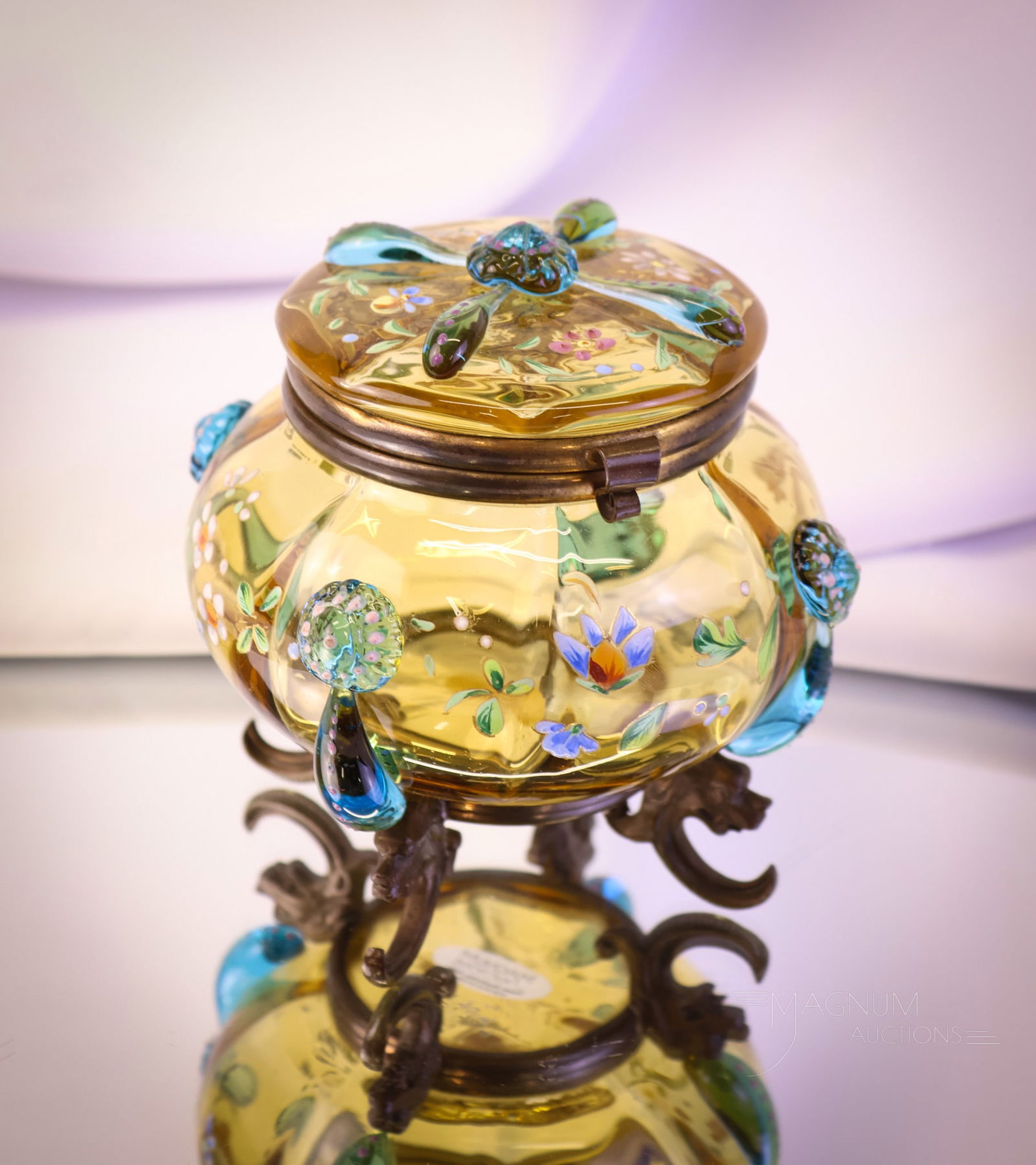 Bohemian Art Glass Applied Glass Jewel Casket: This is a special piece. This is a jewel casket in a rich amber glass. This Bohemian-made example features blue applied tendrils and an applied prunt. The piece is enameled with decoration. The casket