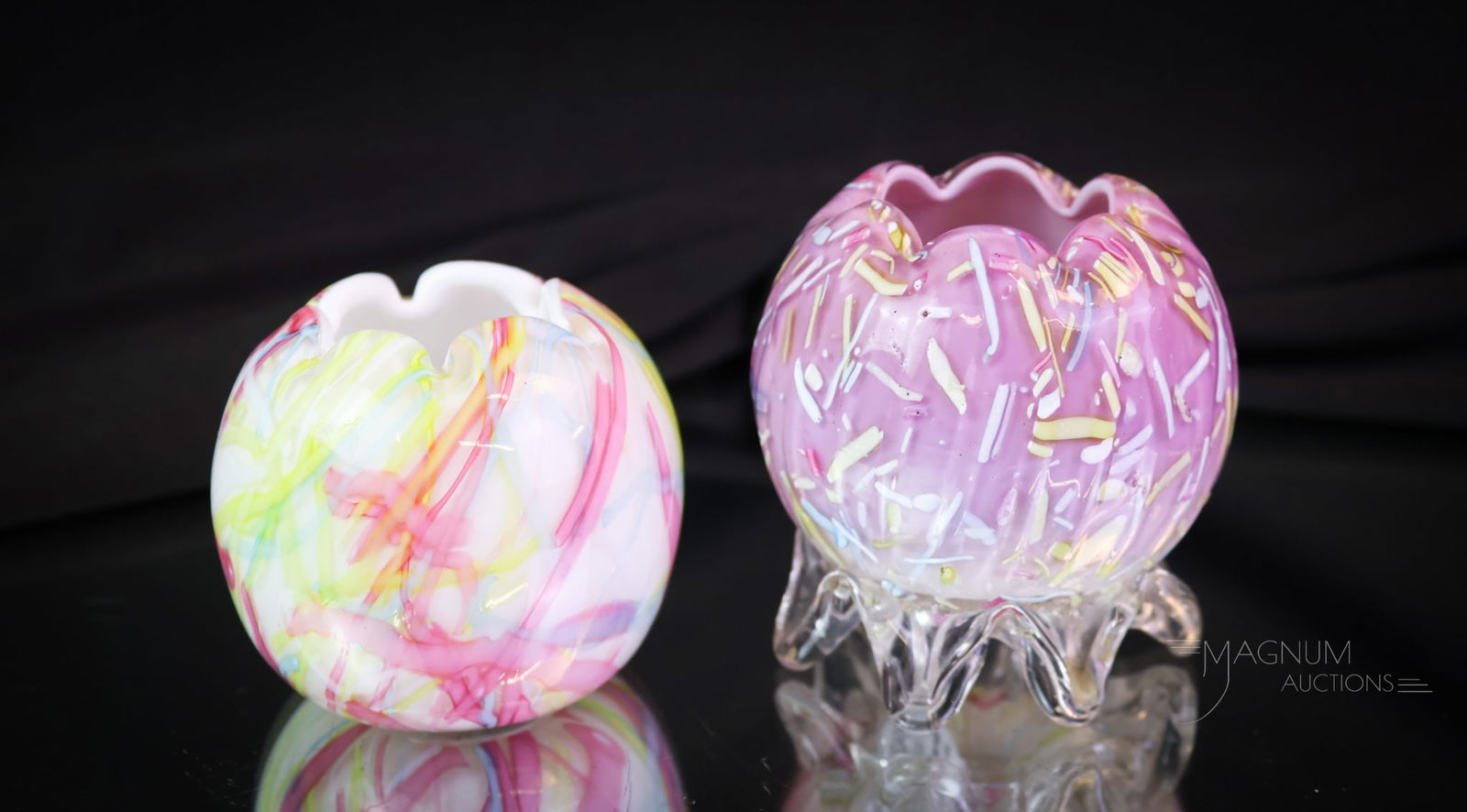 2 pc Lot Peloton Art Glass Miniature Rose Bowls: Two desirable finds in Victorian Peloton art glass miniature rose bowls. The first is a white cased example with rainbow colored threading. The second is a miniature mauve cased glass example with rai