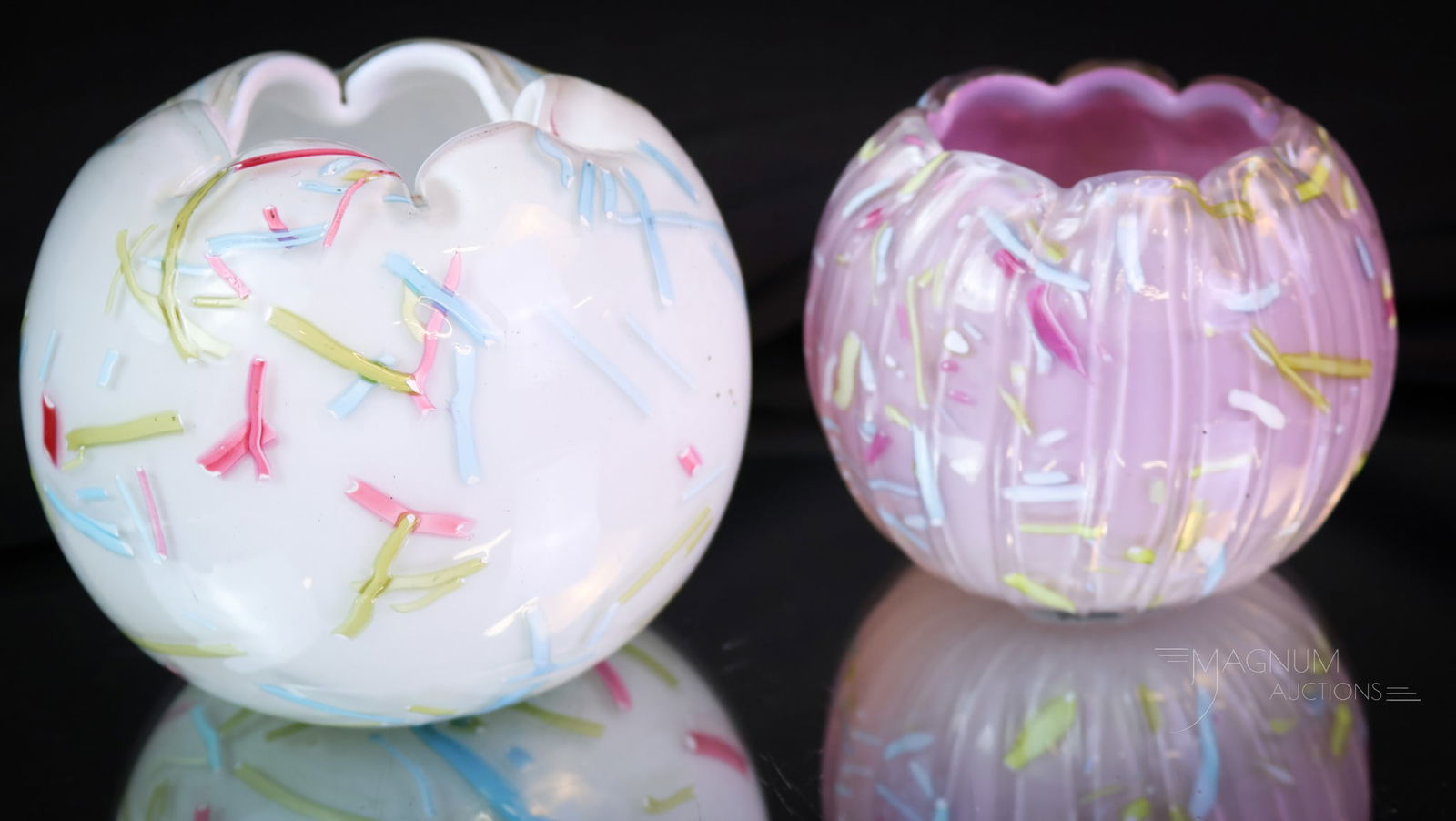 2 pc Lot Victorian Peloton Art Glass Threaded Rose Bowls: Two unique rose bowls for your bidding pleasure in one lot. This lot offers a white cased example with rainbow threading. The second is an externally ribbed mauve cased example with rainbow threading.