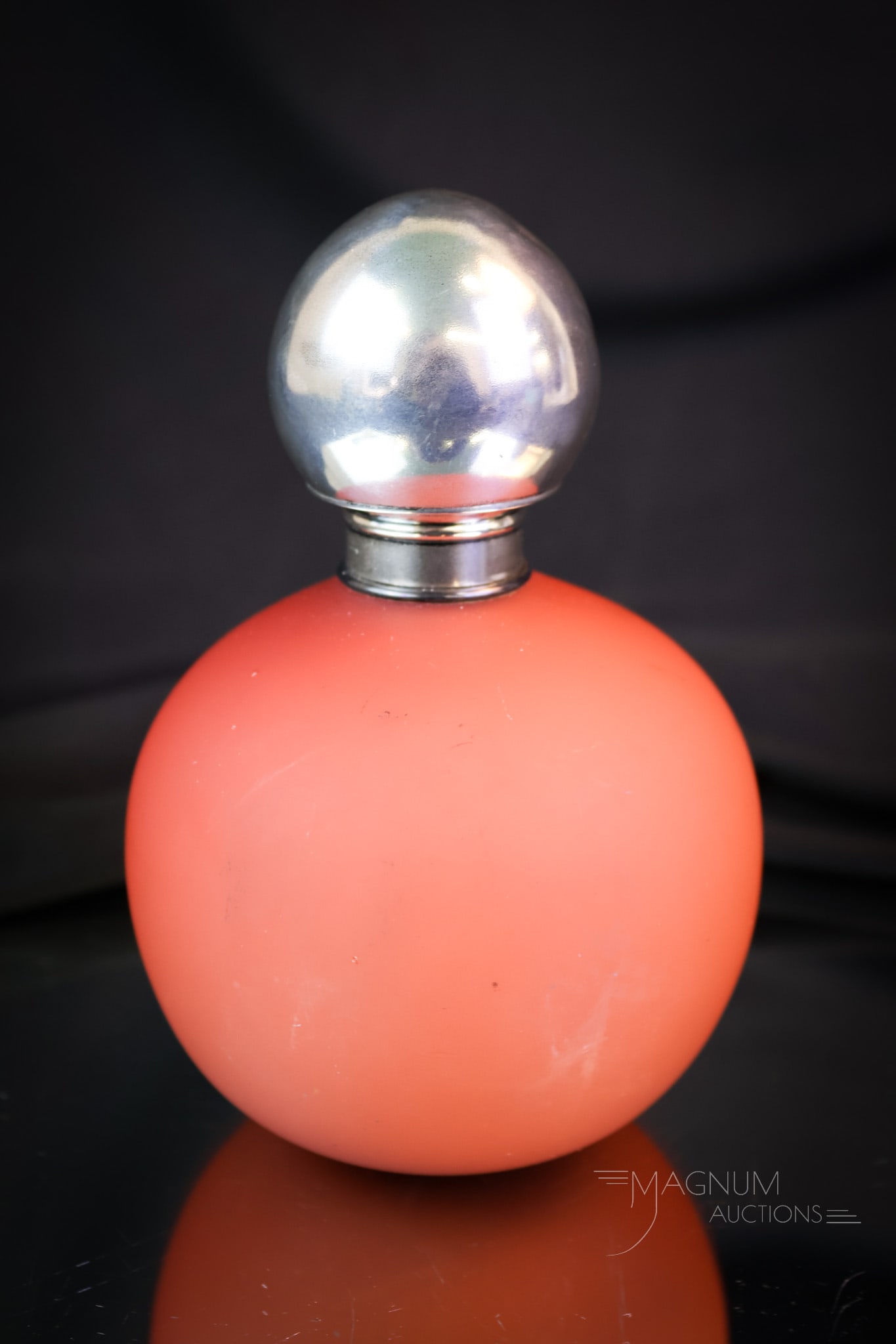 Webb Peachblow Victorian Sterling Silver Perfume Bottle: A nice find for the perfume collectors. This is a Webb Peachblow glass ball-shaped perfume bottle. This one comes with a sterling silver lid. The bottle measures 5" tall and 3 1/2" wide. A minor dent