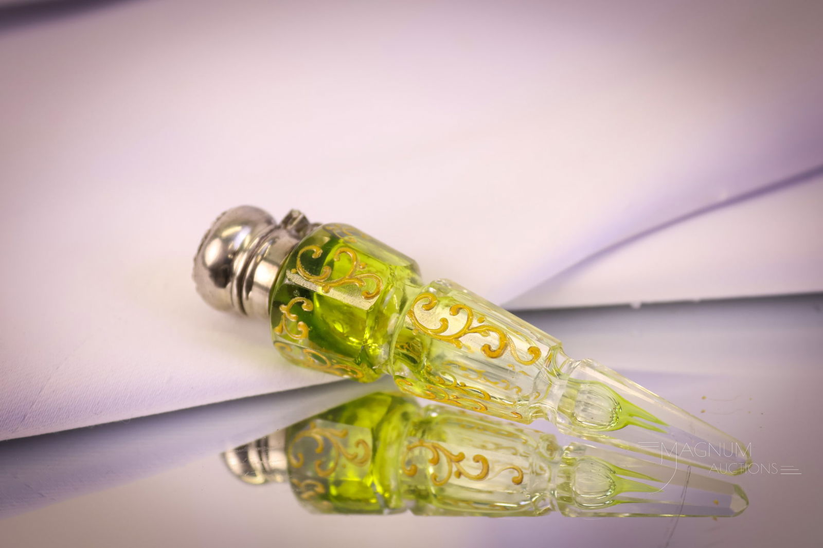 Victorian Lay-down Enameled Glass Perfume Bottle: A nice find in a Victorian enameled glass lay-down perfume bottle. This one is in green to clear glass. The top is unmarked but most likely sterling. The perfume measures 3 3/4" tall. SHIPPING NOTICE: