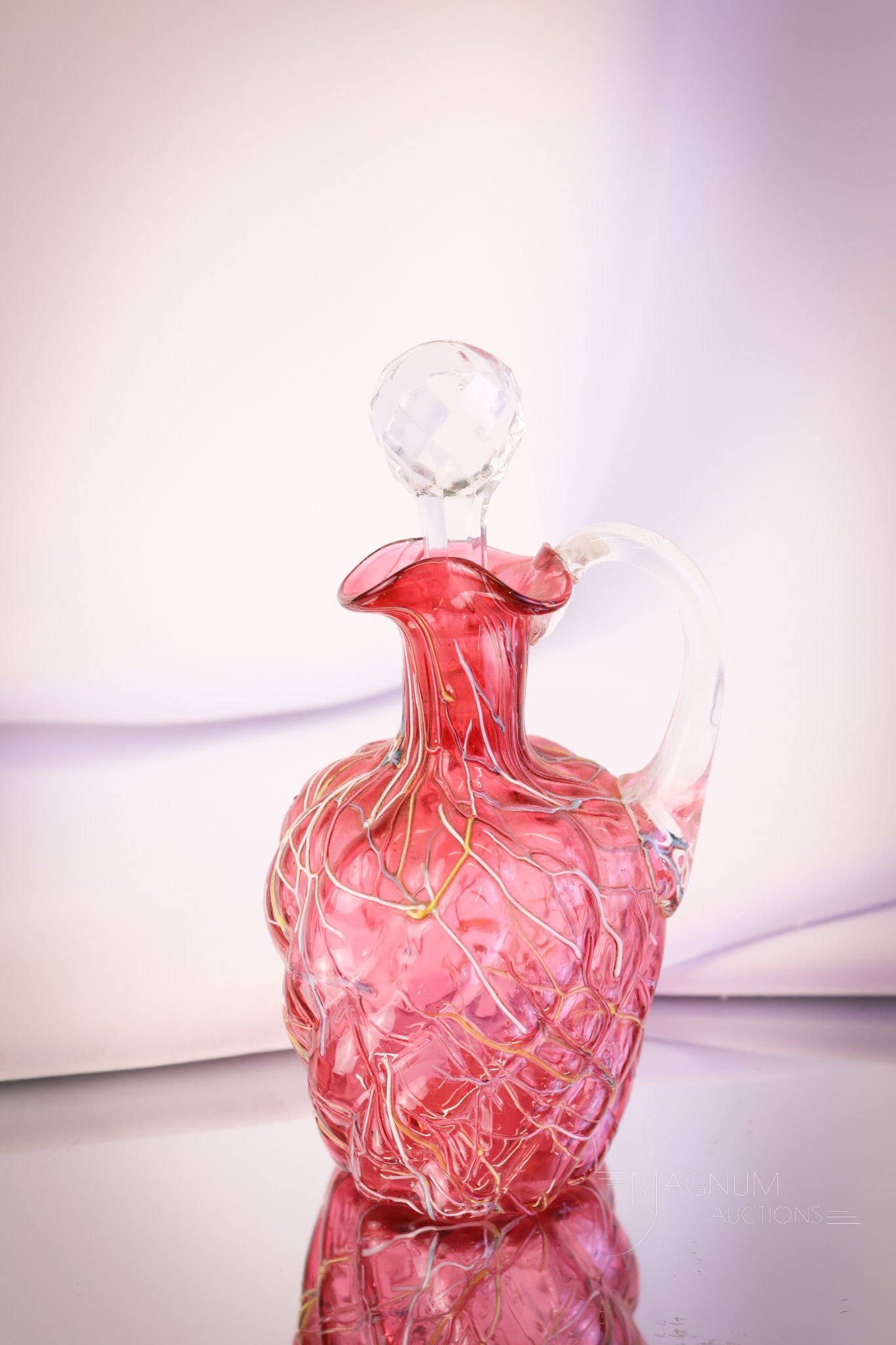 Phoenix Cranberry Peloton Victorian Glass Cruet: A wonderful find in a Victorian cranberry Peloton decorated cruet. This cruet is attributed to Phoenix glass. It's one of their classic shapes. This cruet measures 6 3/4" tall. SHIPPING NOTICE: If you