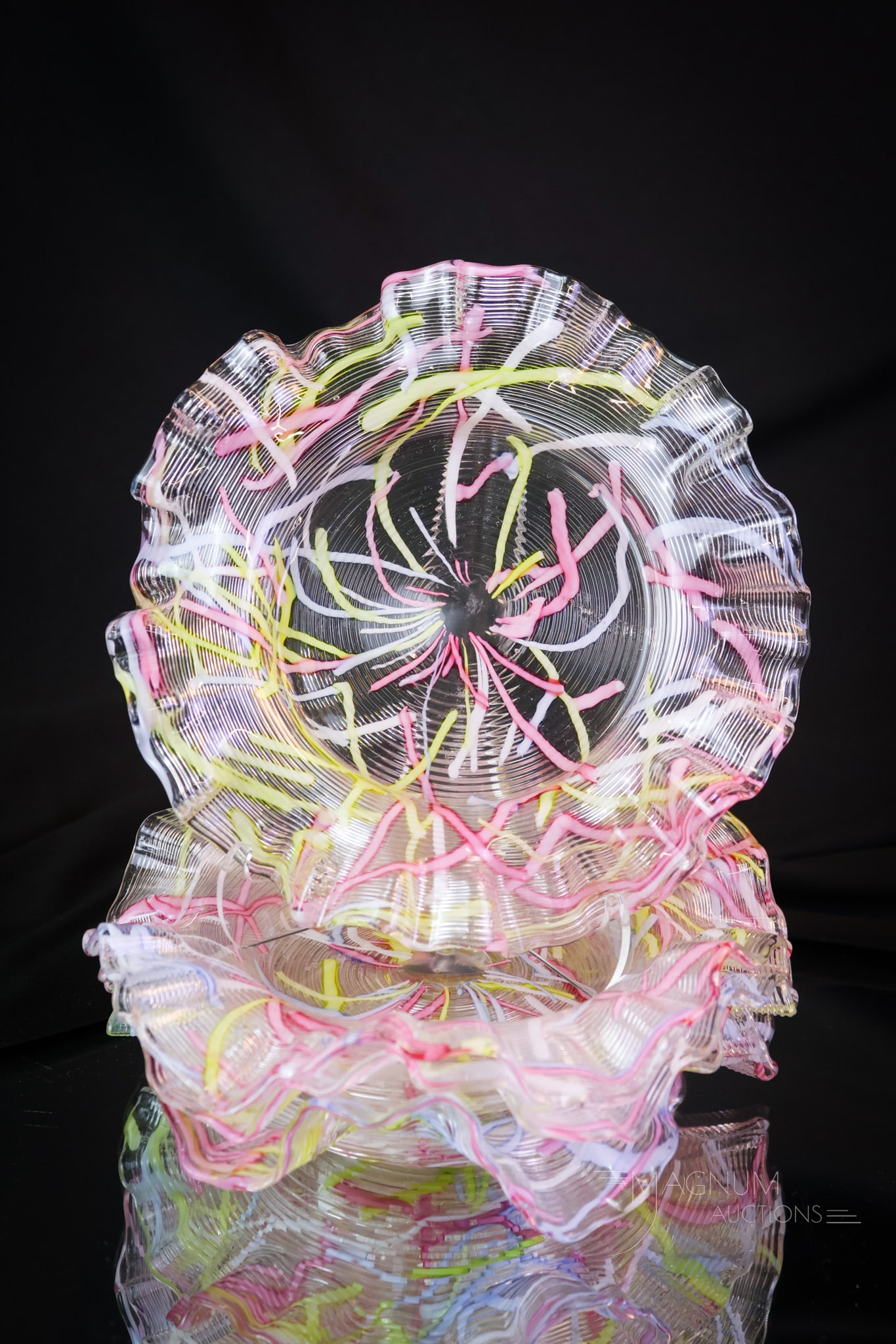 4 pc Lot Peloton Threaded Art Glass Plates: Four rare examples of threaded Peloton decorated art glass plates. Each plate is decorated with rainbow threading. Each plate measures 1 1/4" tall and 6" in diameter. SHIPPING NOTICE: If you choose no