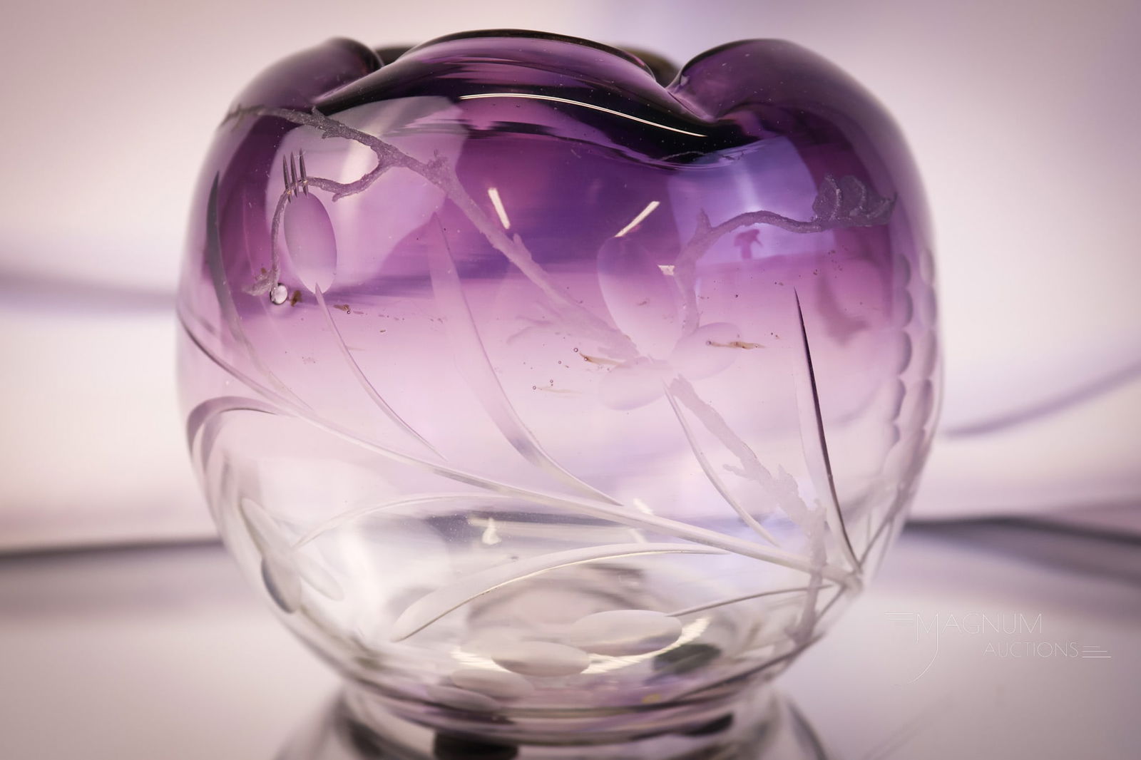 Moser Engraved Art Glass Amethyst Rose Bowl: An attributed to Moser amethyst art glass rose bowl. This beautiful find has ombre coloring from a deep amethyst to clear. The piece is engraved with florals. The rose bowl measures 4" tall. SHIPPING