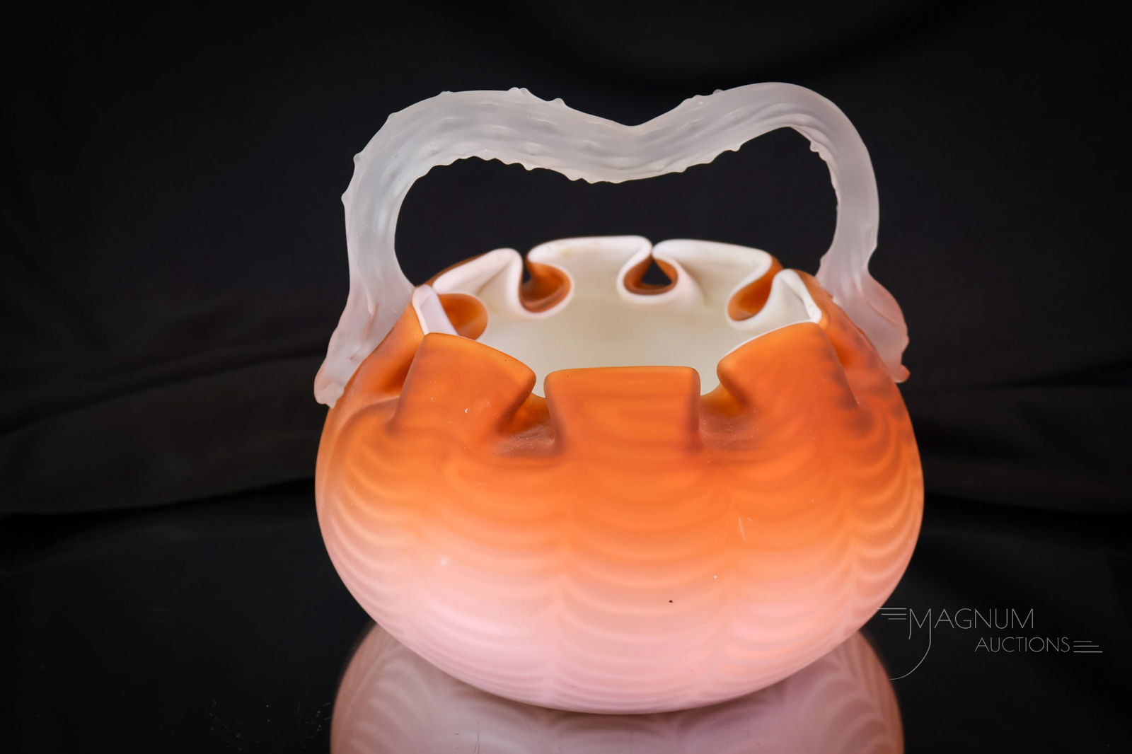 Victorian Mother of Pearl Satin Glass Drapery Art Glass Basket: A beautiful find for your collection. This is a Victorian mother-of-pearl glass basket. The color is orange. The pattern is Drapery. The basket features an applied thorn handle. The piece measures 5 1