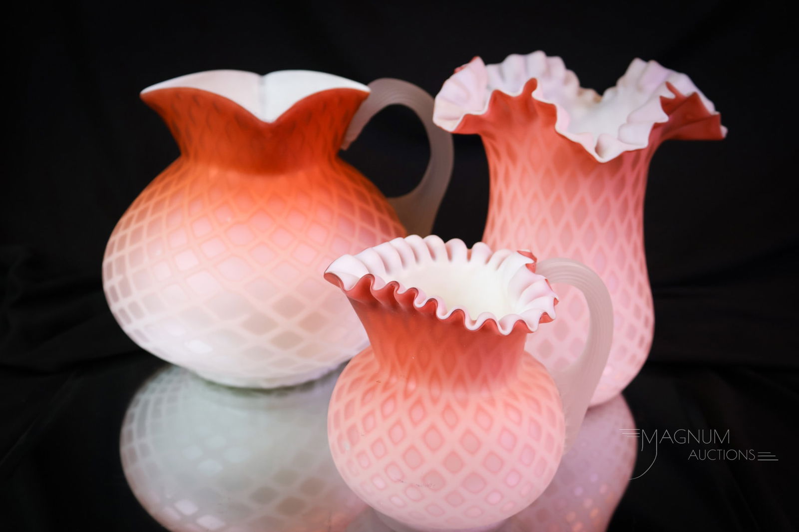 3 pc Lot Salmon Victorian Mother of Pearl Art Glass Pitcher Celery Creamer: A three-piece lot of Victorian salmon-colored mother-of-pearl art glass. This lot includes a water pitcher, a creamer, and a celery vase. Each has rich color and a satin finish. All are in the diamond