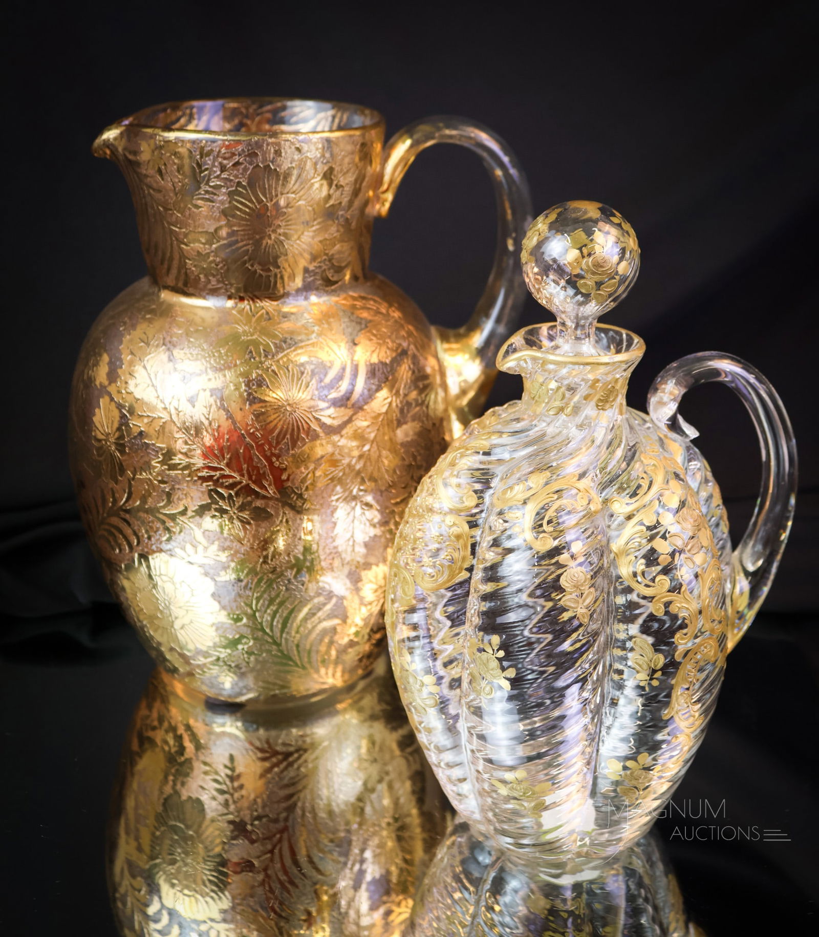 2 pc Lot Moser Gold Decorated Victorian Art Glass: Two super examples of Victorian Moser art glass. The first is a water pitcher. The second is a claret decanter. Each is a unique and gorgeous example of decorated Moser art glass. The tallest measures