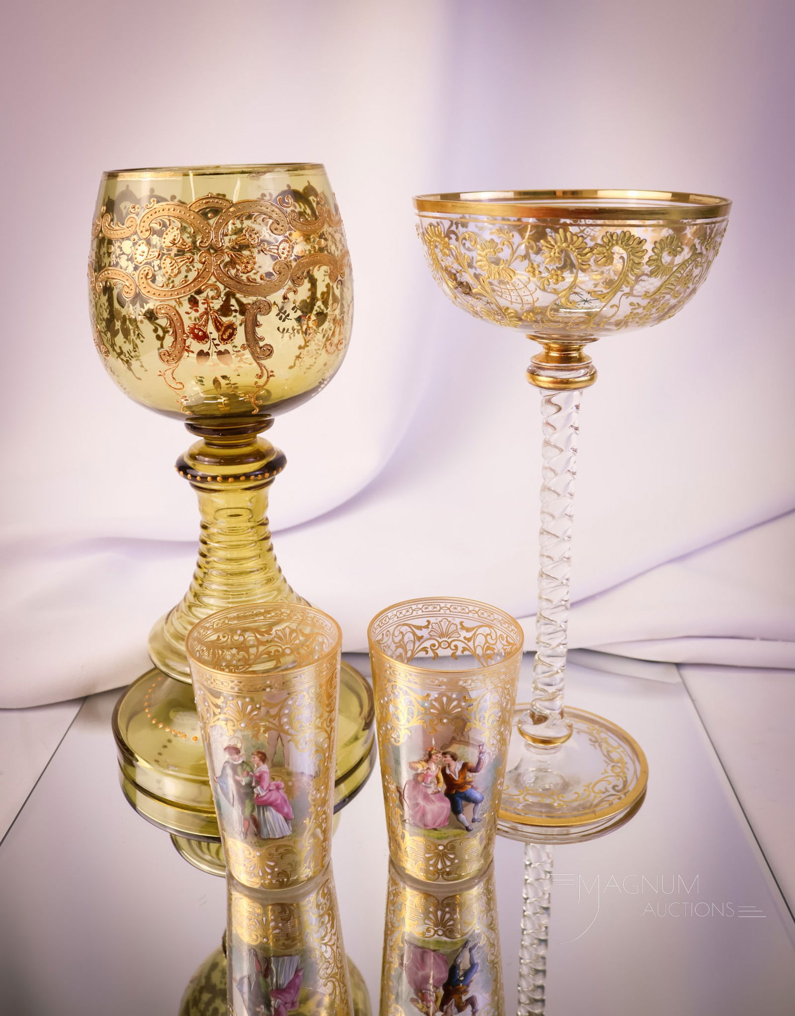4 pc Lot Moser Type Victorian Glass Goodies: Four distinct finds in Victorian Moser type glass. This lot offers two chalices and two juice tumblers. Gold and enamel decoration complement each piece. The tallest measures 10". SHIPPING NOTICE: If