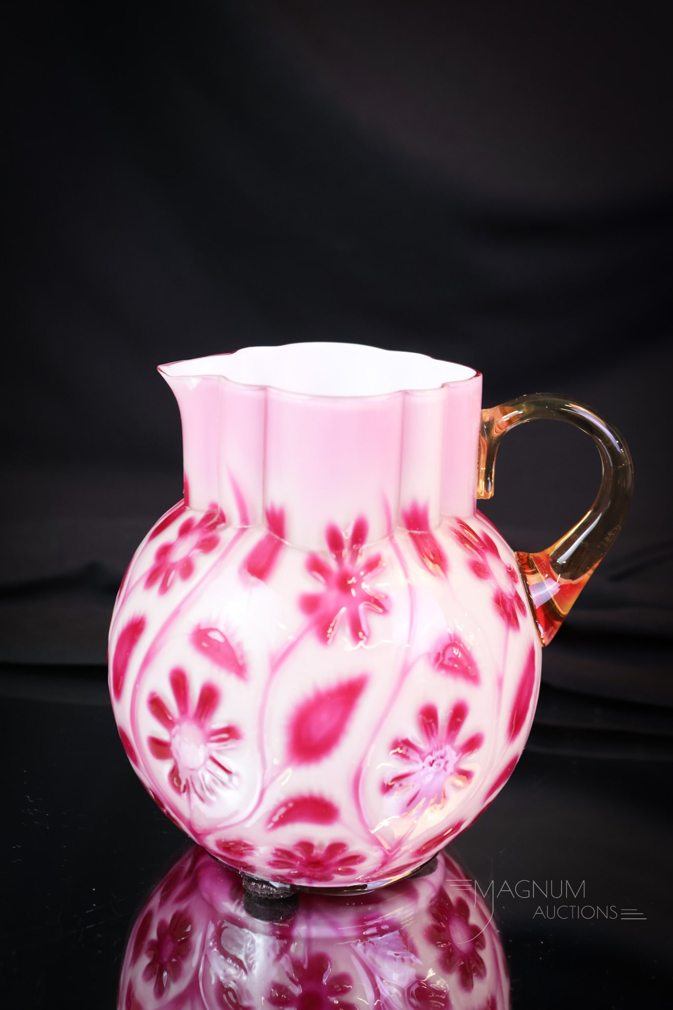 Rare Victorian Findlay Raspberry Onyx Art Glass Cream Pitcher: A gorgeous and rare find in a Victorian piece of Findlay Glass. This is a raspberry onyx art glass cream pitcher. Seldom do these come to auction. This creamer has incredible coloring and is rarely fo