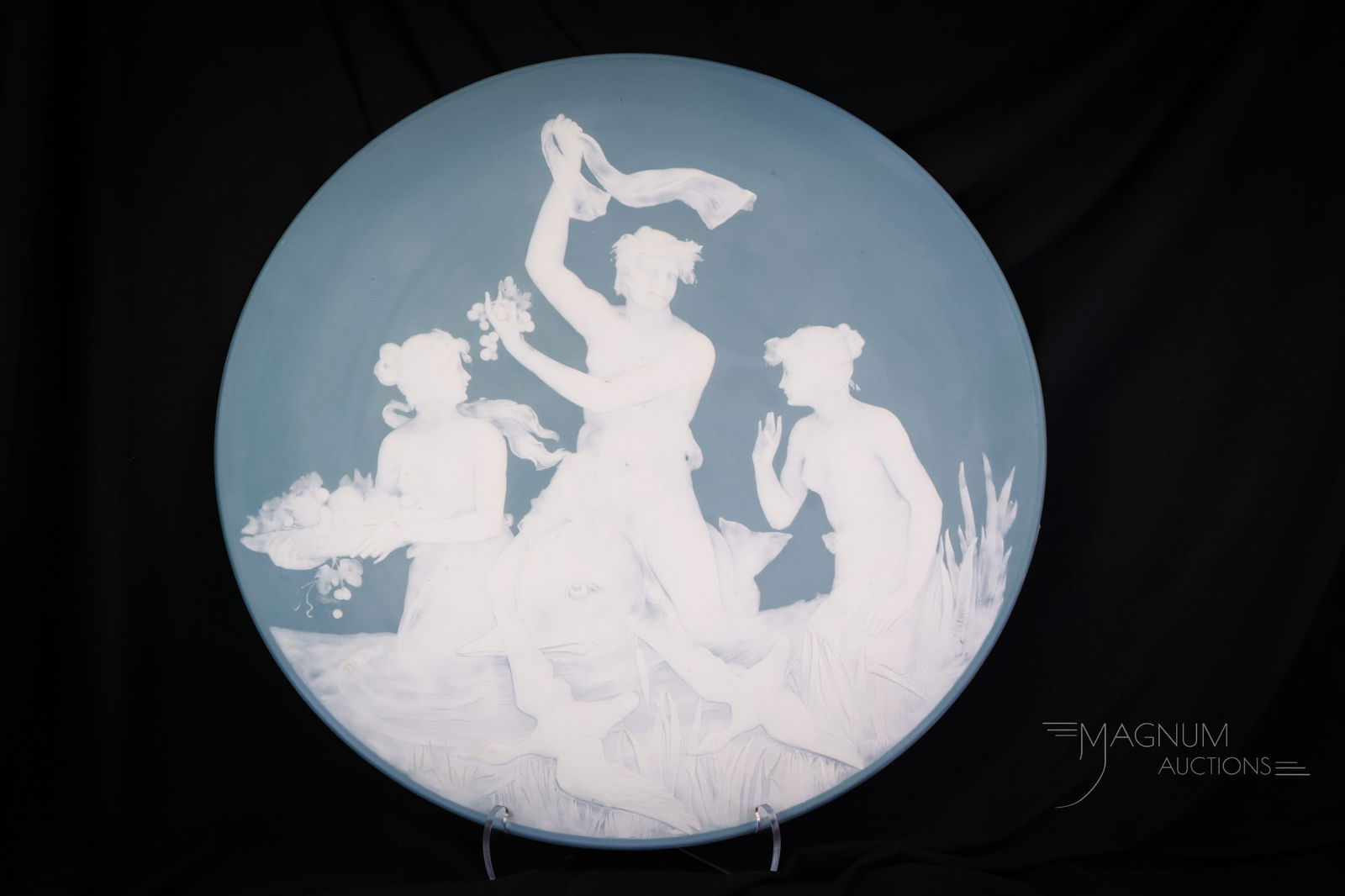 21" Mettlach Phanolith Cameo Charger circa 1901 by Jean Bapist Stahl: A fine 21" diameter Mettlach Phanolith cameo charger, circa 1901. This piece designed by Jean Bapist Stahl features a mythological scene. SHIPPING NOTICE: If you choose not to utilize the LiveAuctione