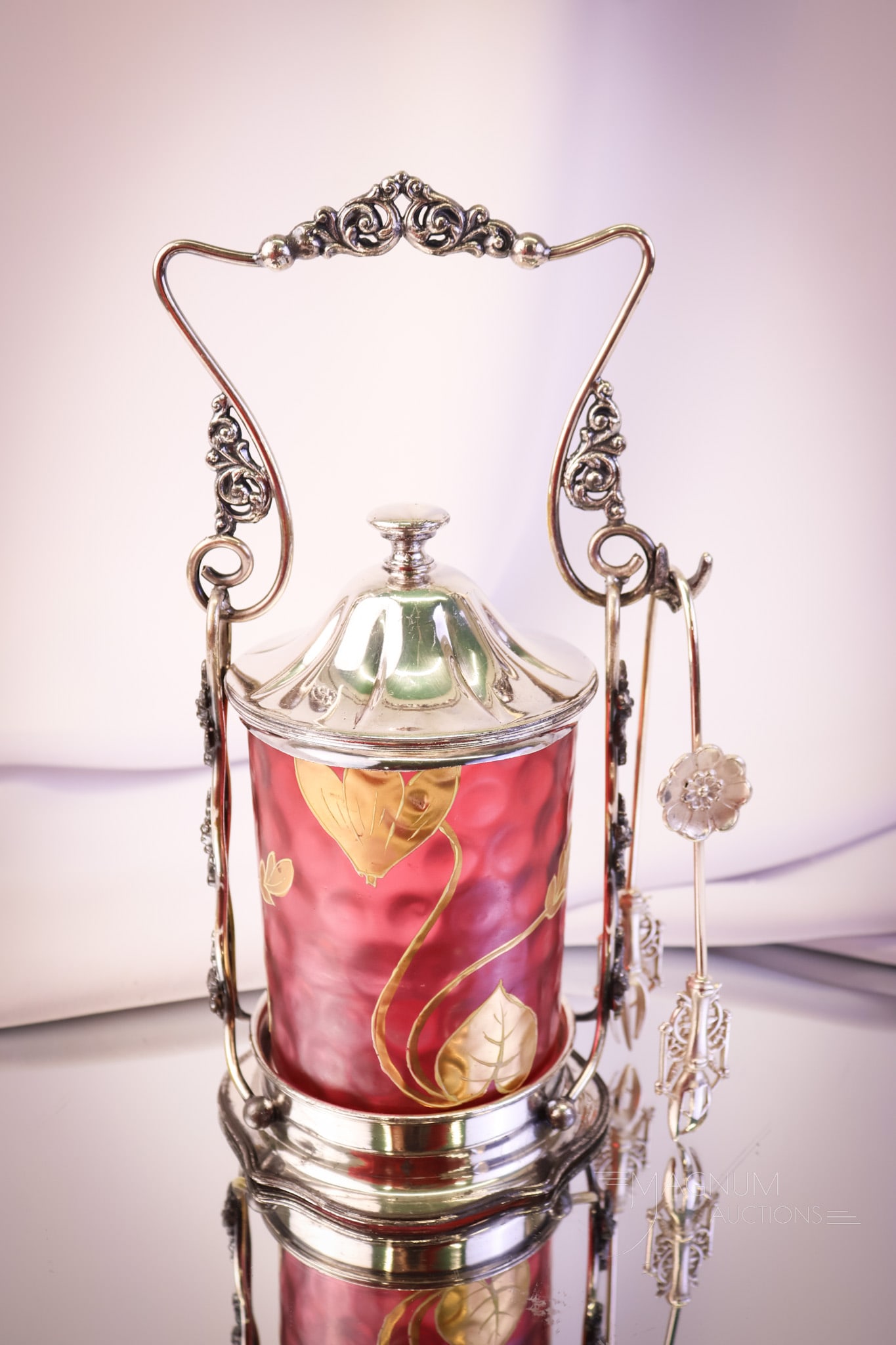 Forbes Silverplate Victorian Cranberry Gilt Glass Pickle Castor: A wonderful example of a gorgeous Victorian pickle castor. This beauty has a cranberry gilt and enameled glass jar. It resides in a signed Forbes silverplate frame. This delightful find measures 9 1/2
