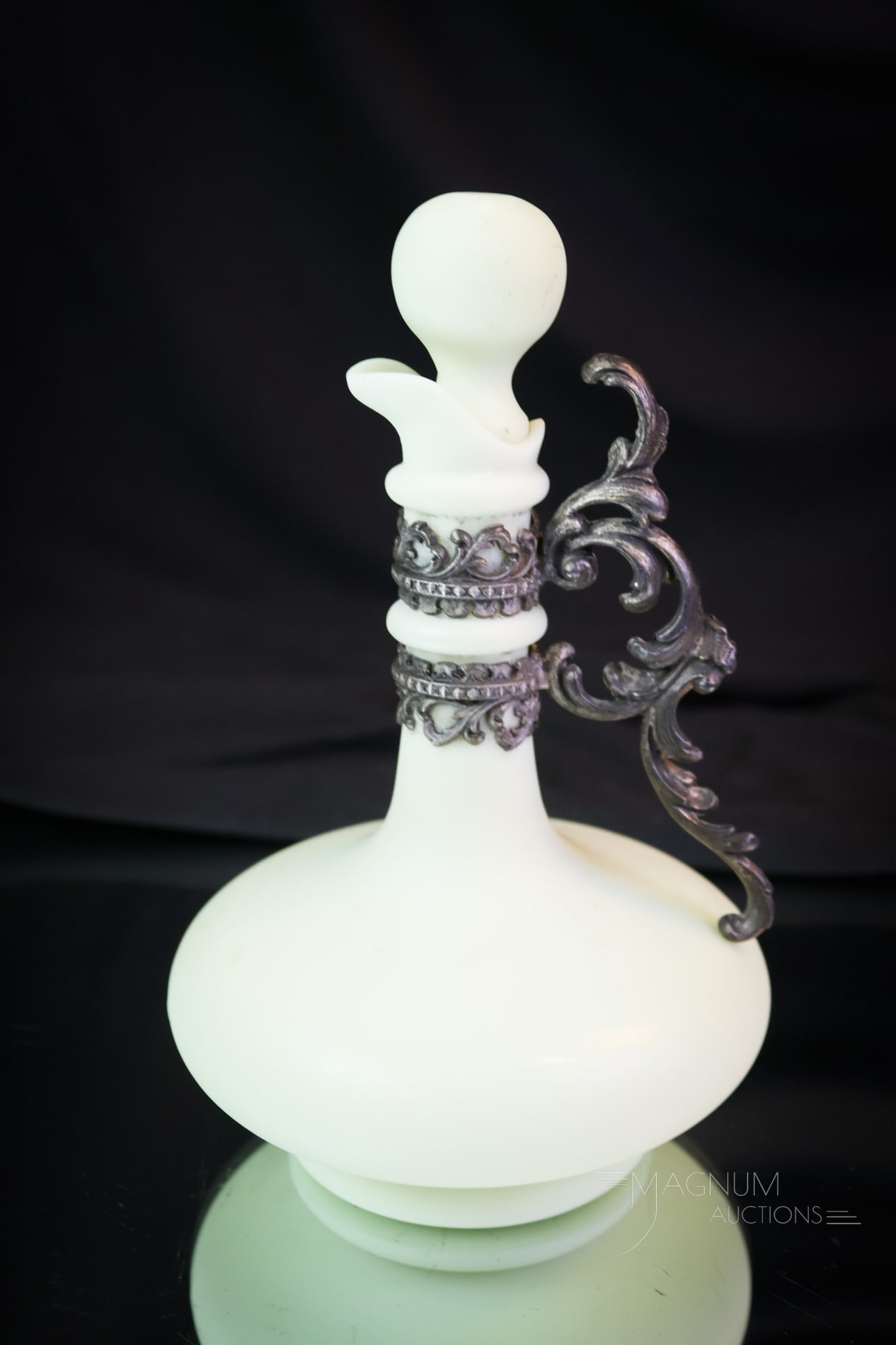 Rare Victorian Wavecrest Opaque Cruet: A rare find in a Victorian art glass cruet. This one is by Wavecrest in opaque green satin. This fine example retains the original matching stopper. The cruet features an ornate applied metal handle.